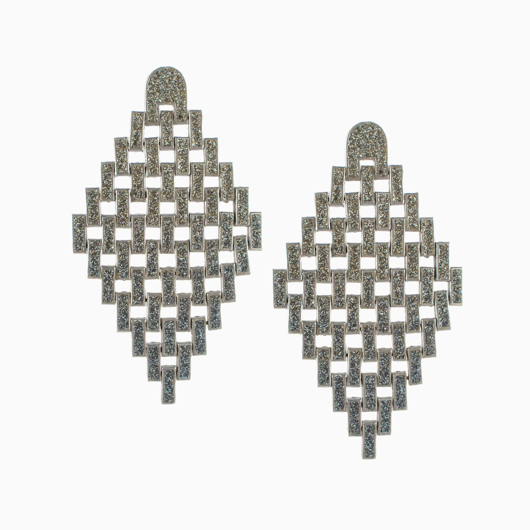 Pair of geometric earrings on a white background