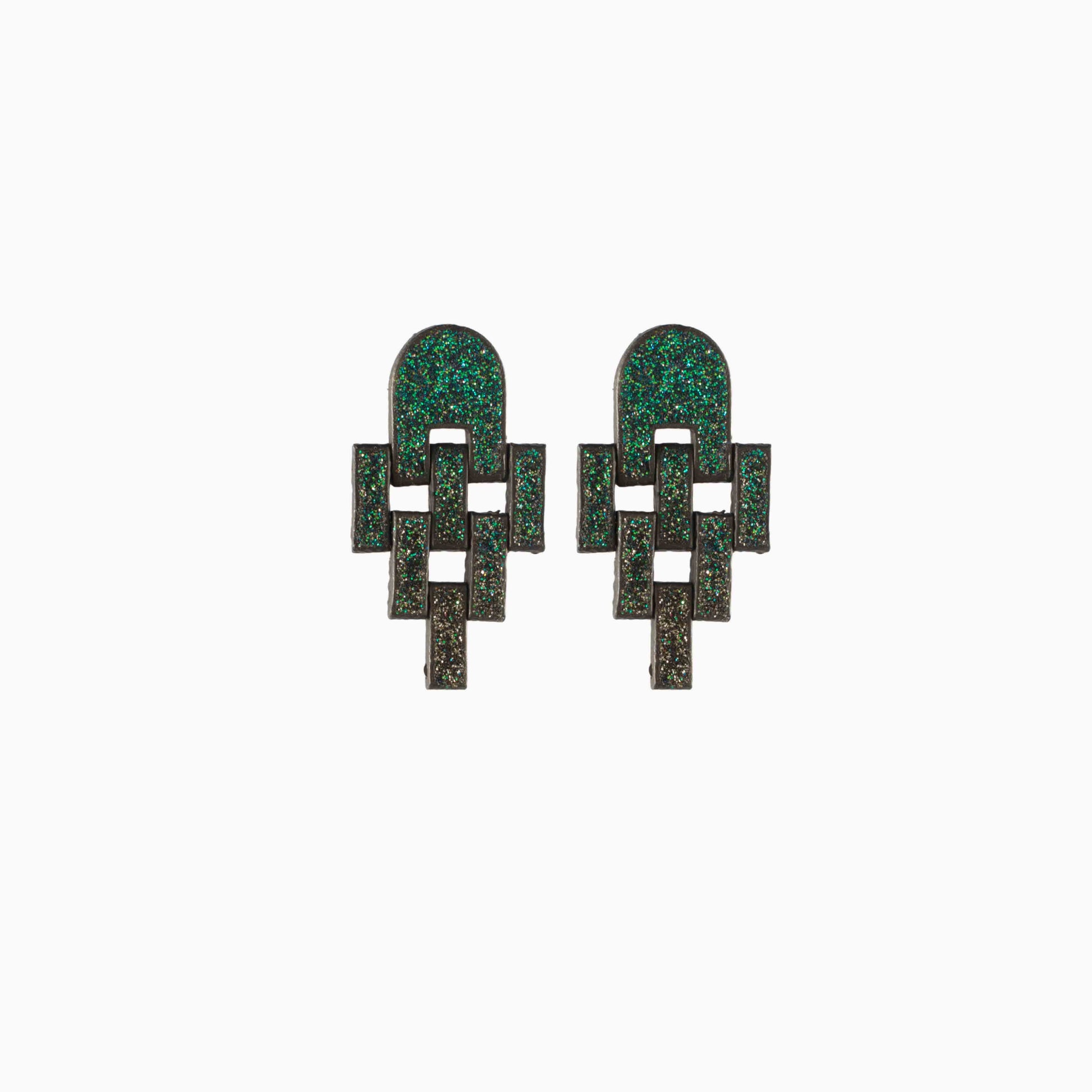Pair of green geometric earrings on a white background