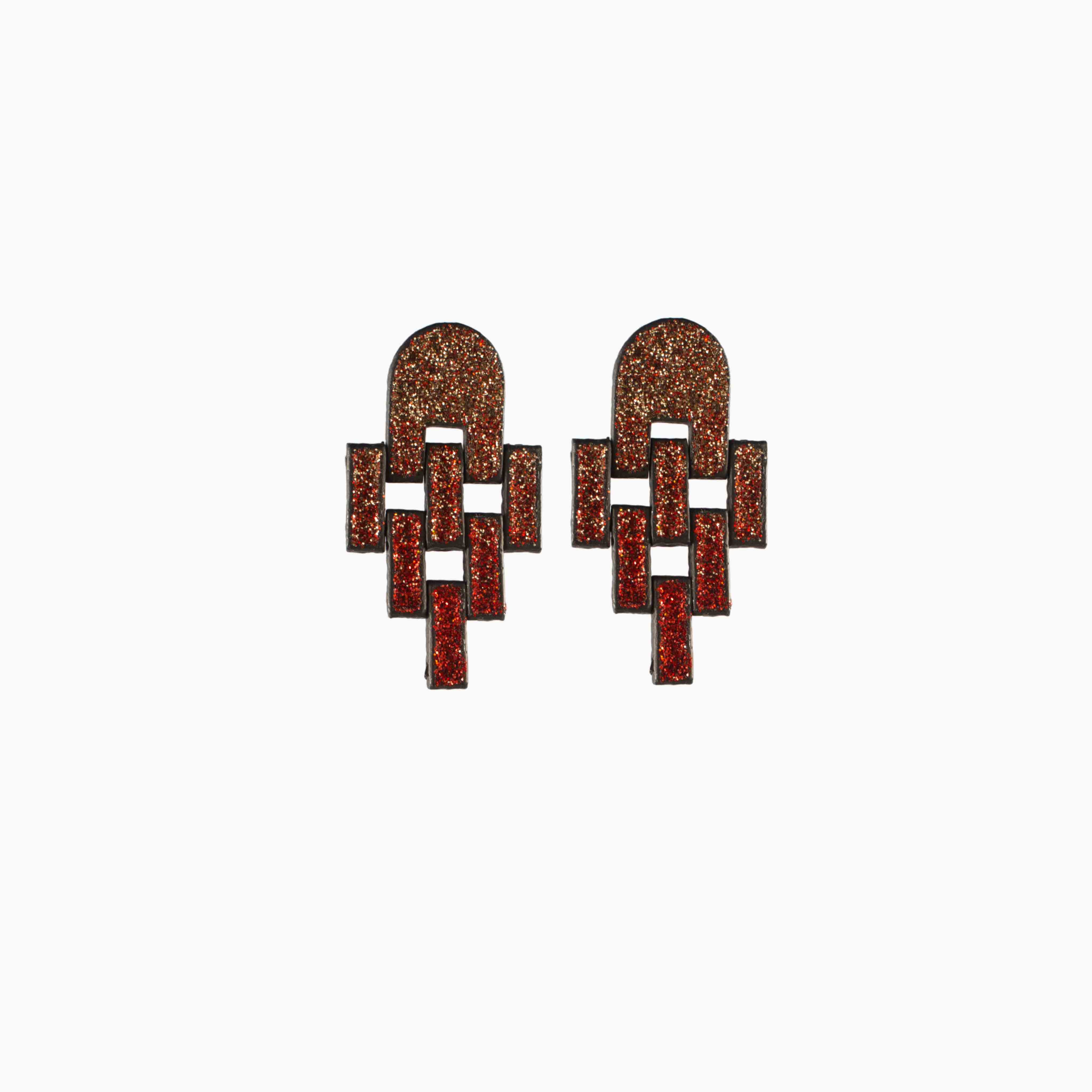 Pair of earrings with geometric design on a white background