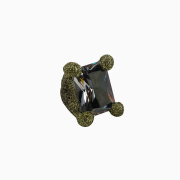 Crystal ring with green gemstones on a white background