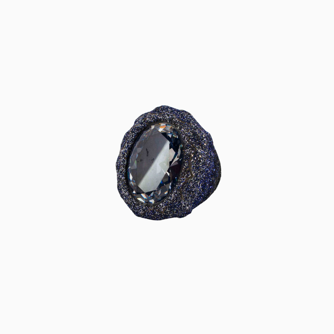 Black stone with a central clear gemstone on a white background