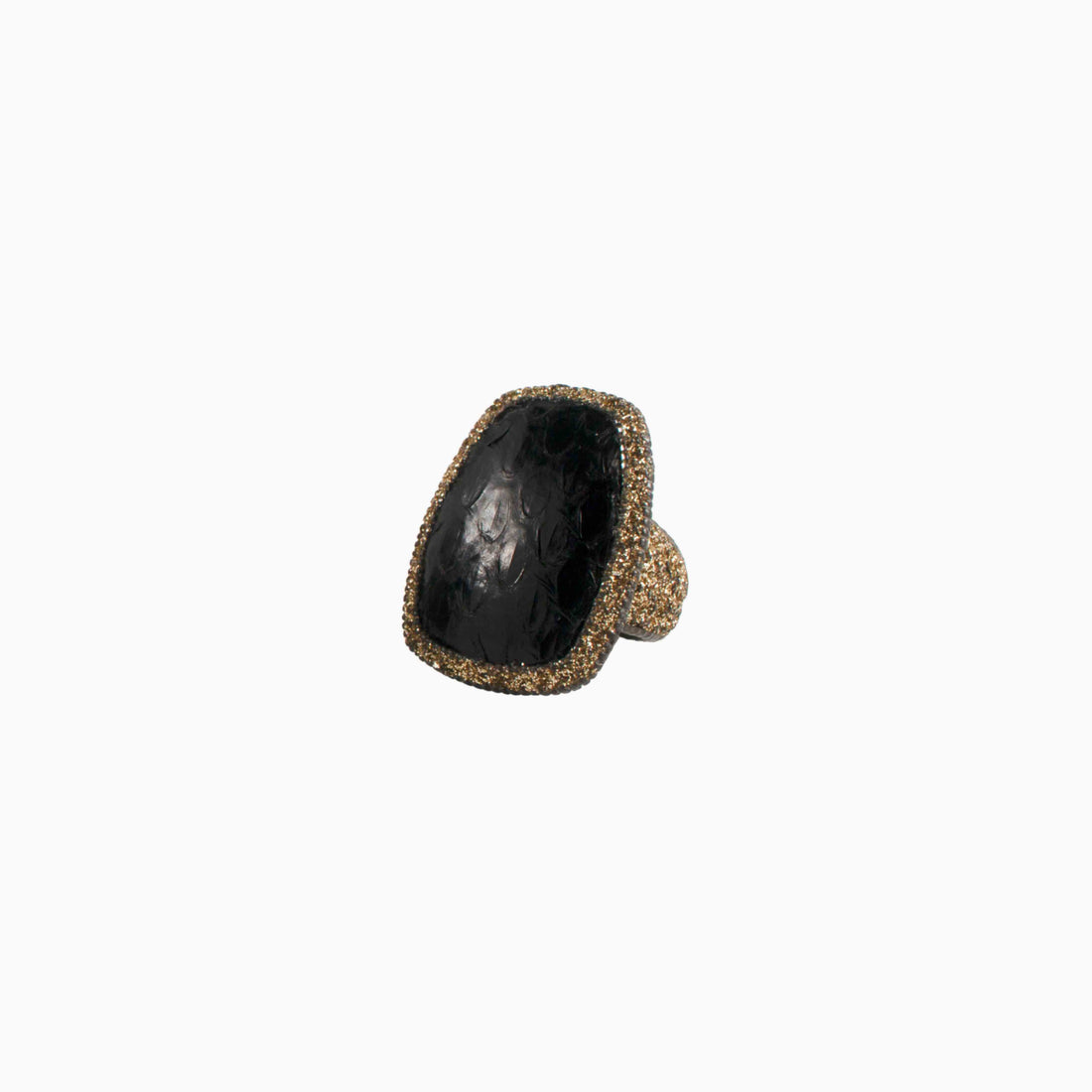 Ring with blue stone and gold accents on a white background