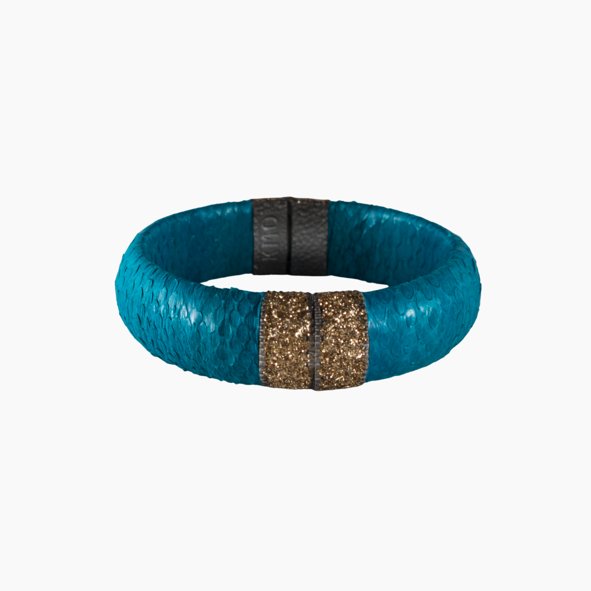 Turquoise textured bracelet with a gold and black clasp on a white background