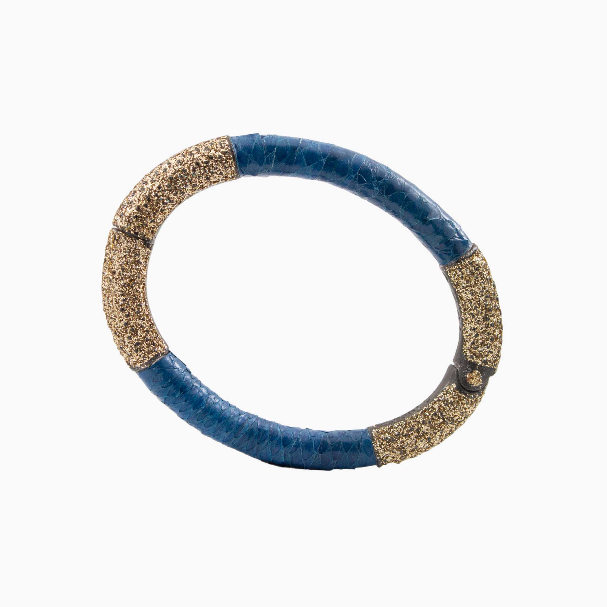 Blue and gold bracelet on a white background