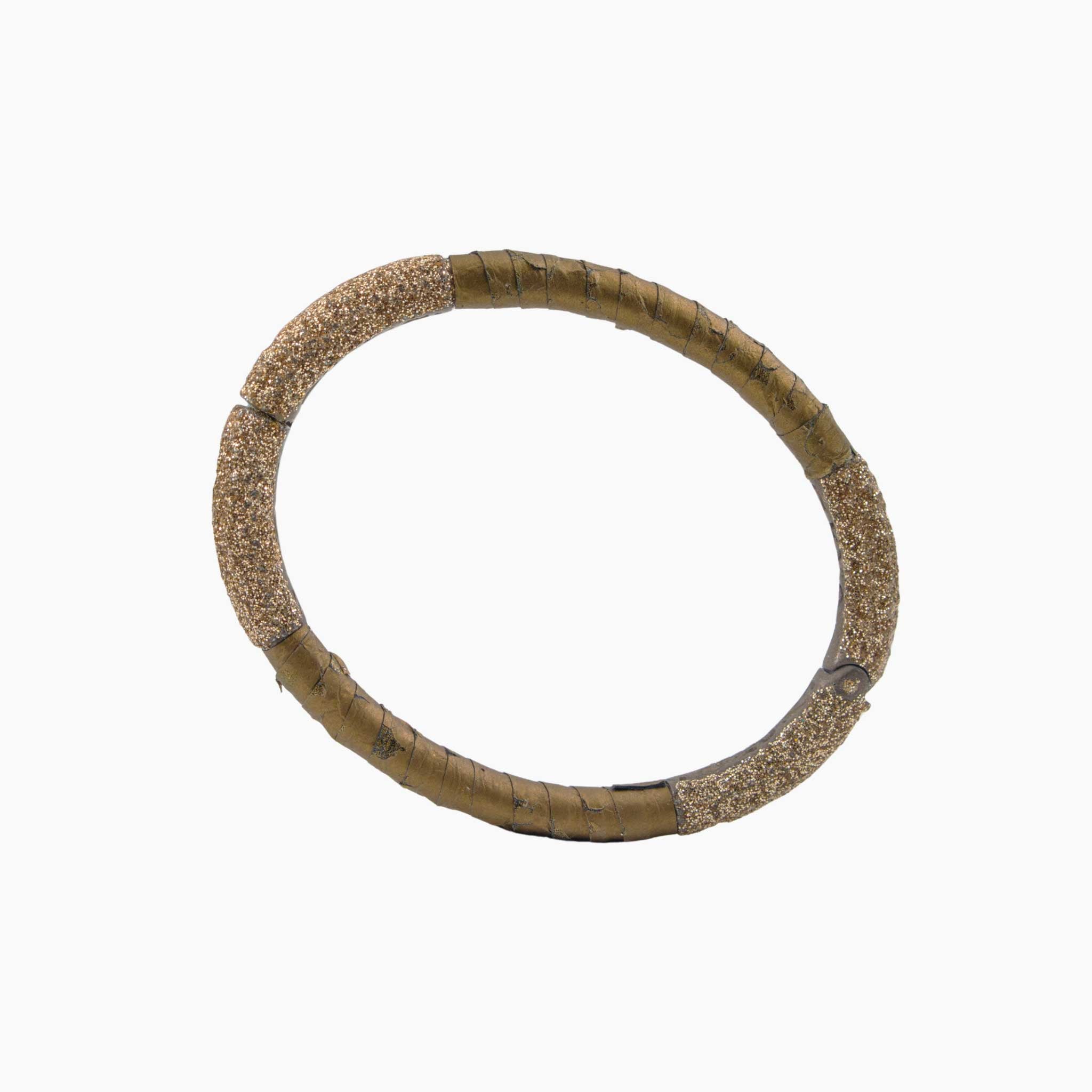 green bangle bracelet on a white background