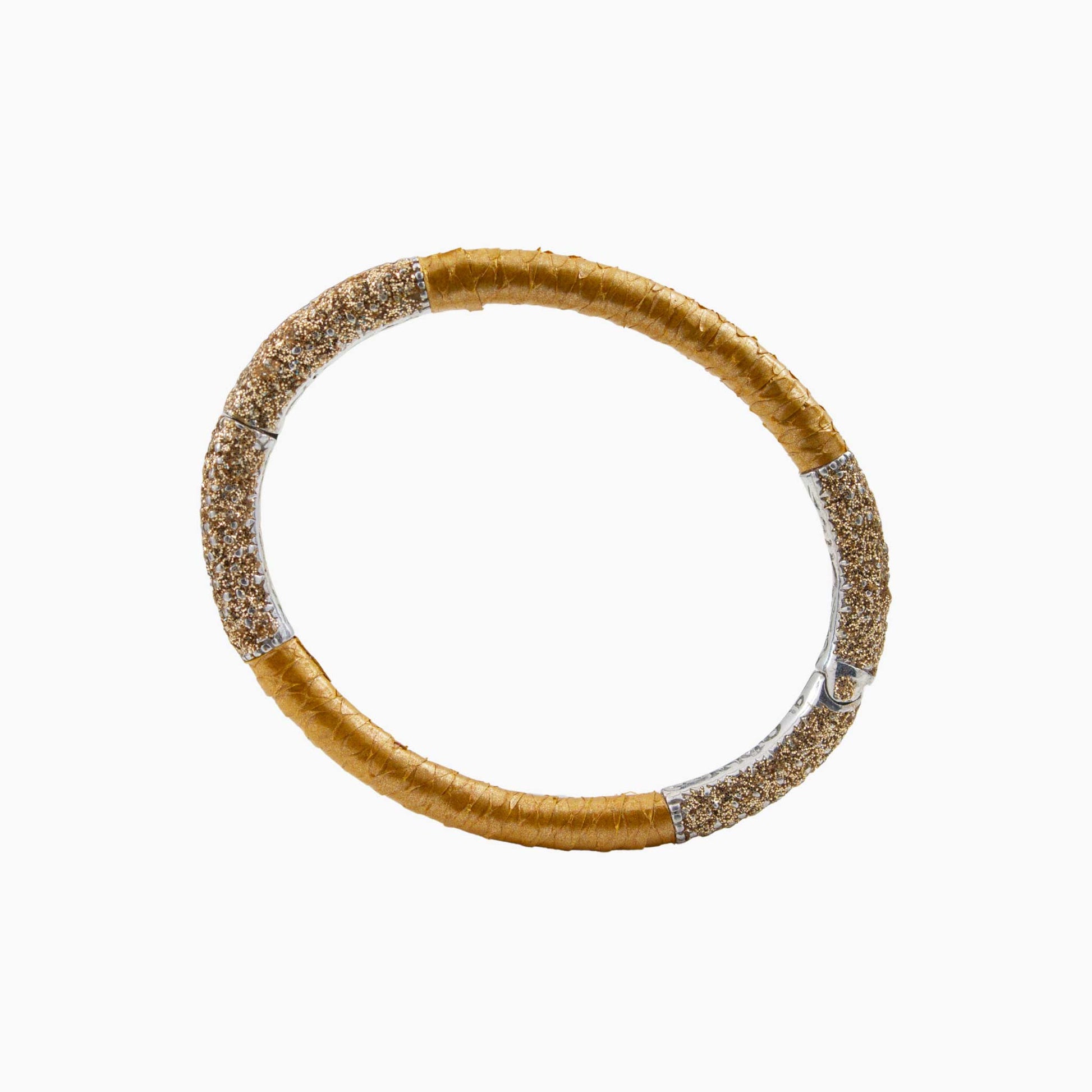 Gold bracelet with glittery accents on a white background