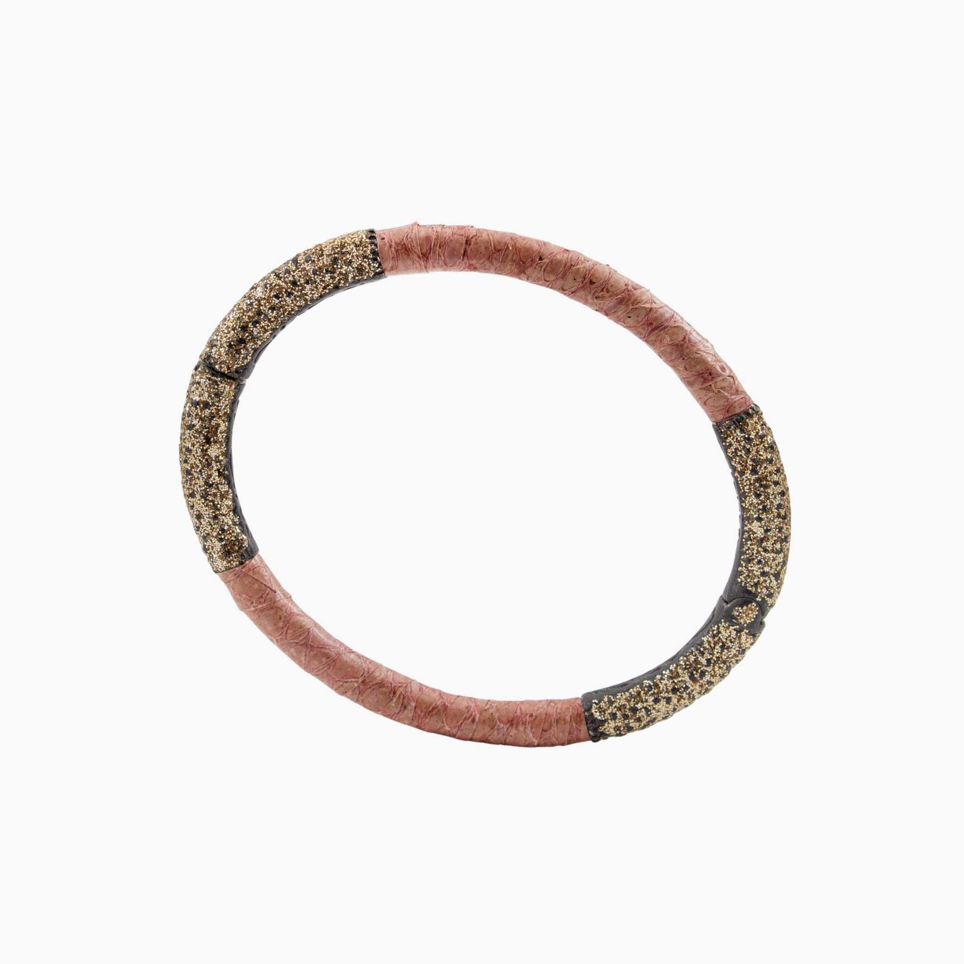 Bracelet with pink and black pattern on a white background