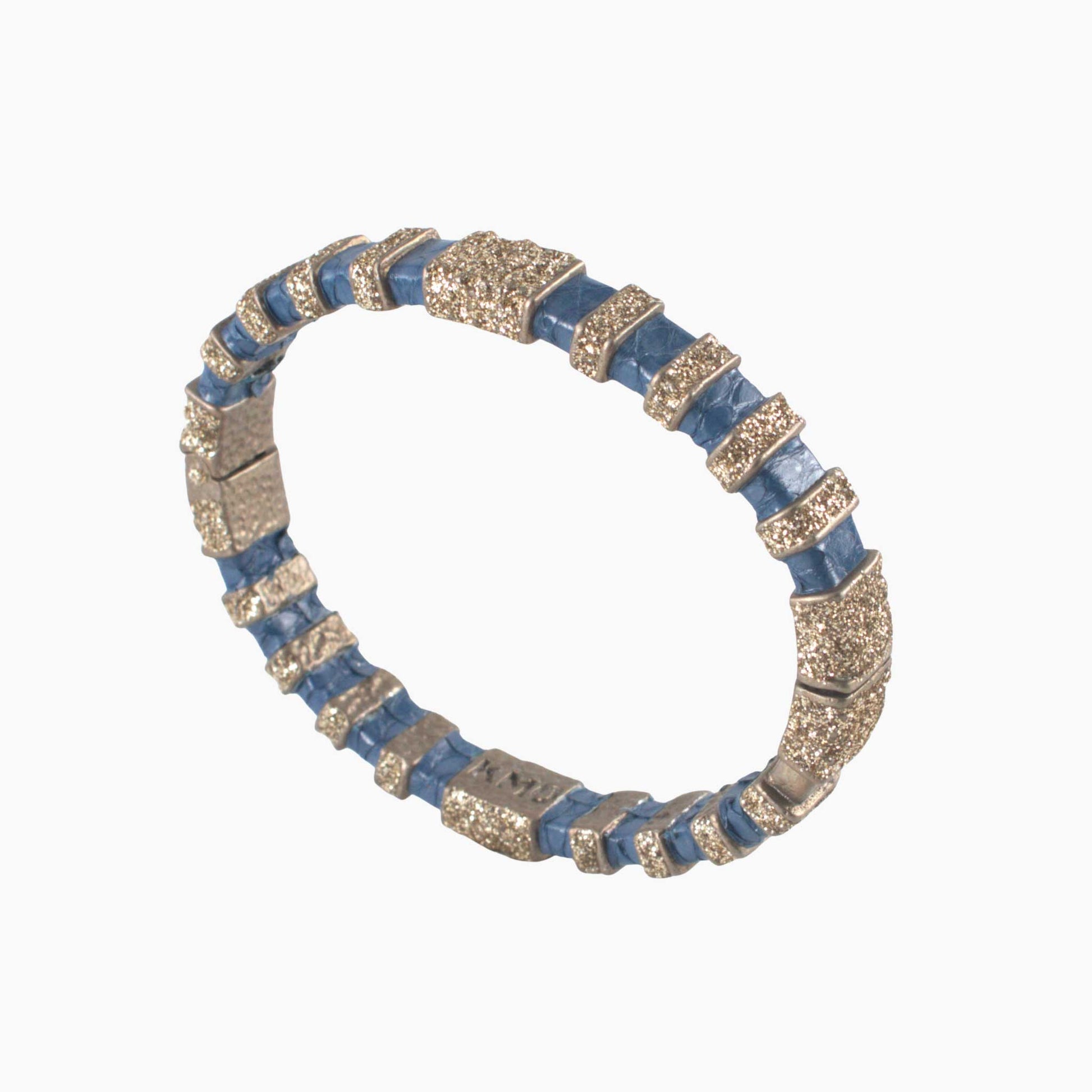 Bracelet with blue and gold beads on a white background