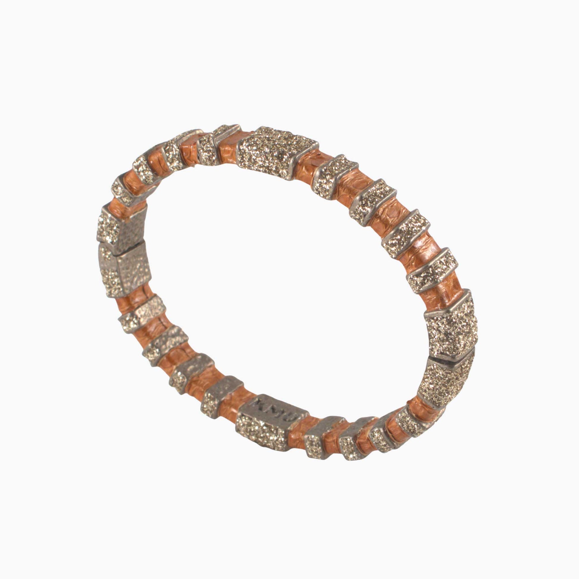 Bracelet with brown and silver pattern on a white background