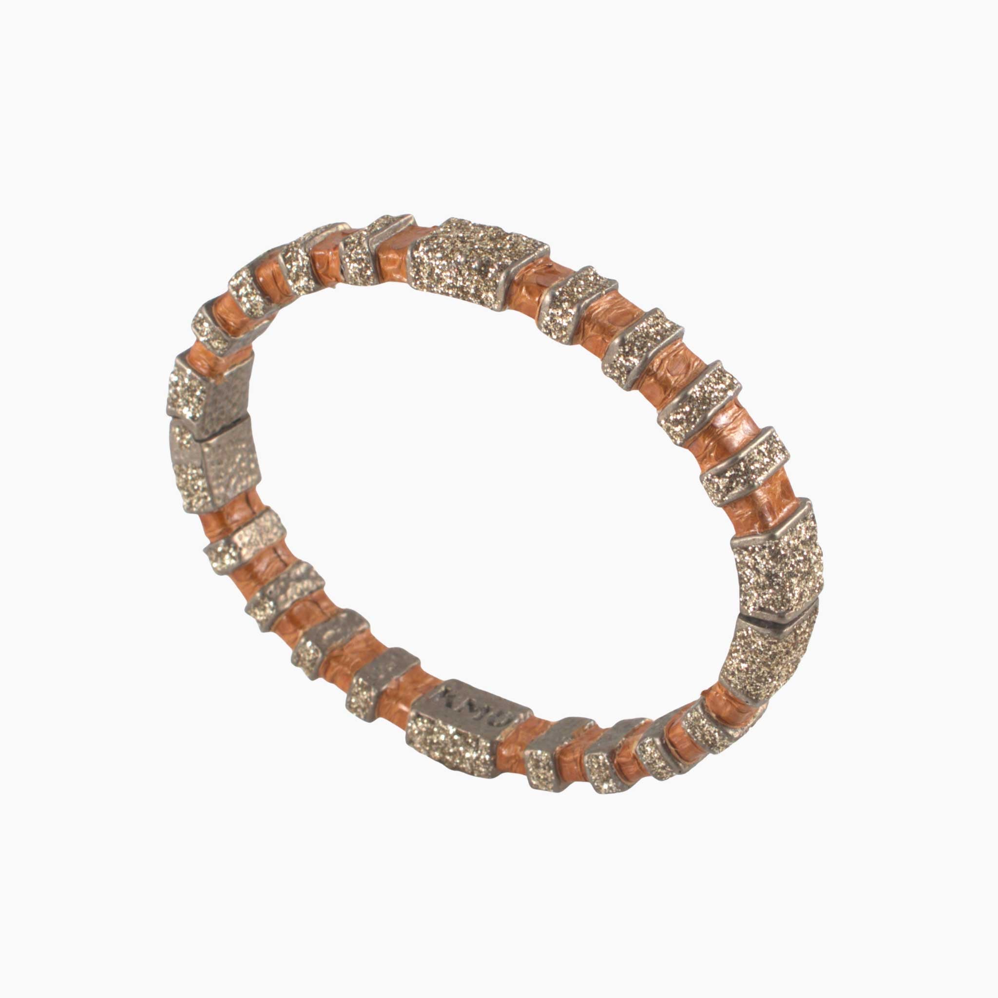 Bracelet with brown and silver pattern on a white background