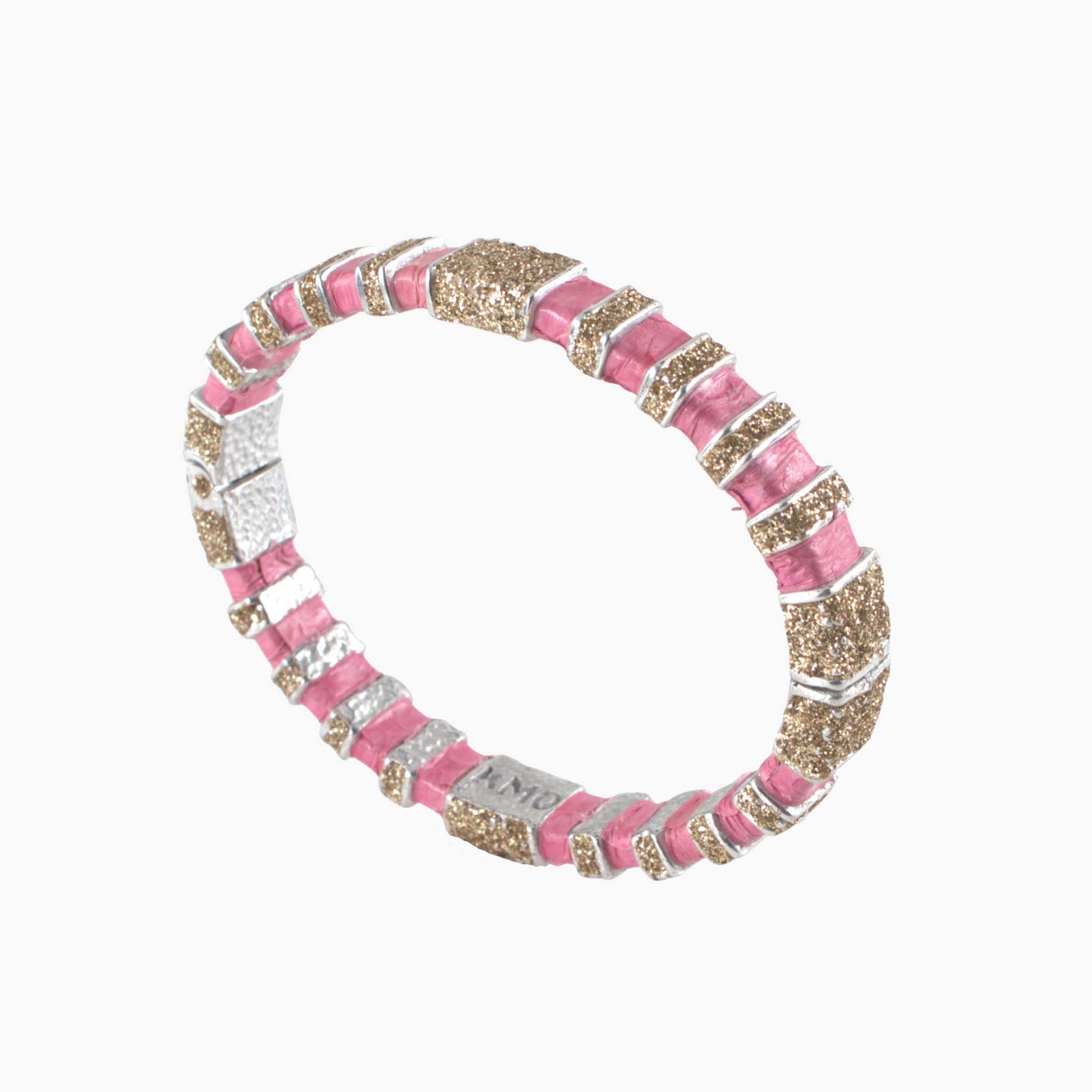 Bracelet with pink, gold, and silver stripes on a white background