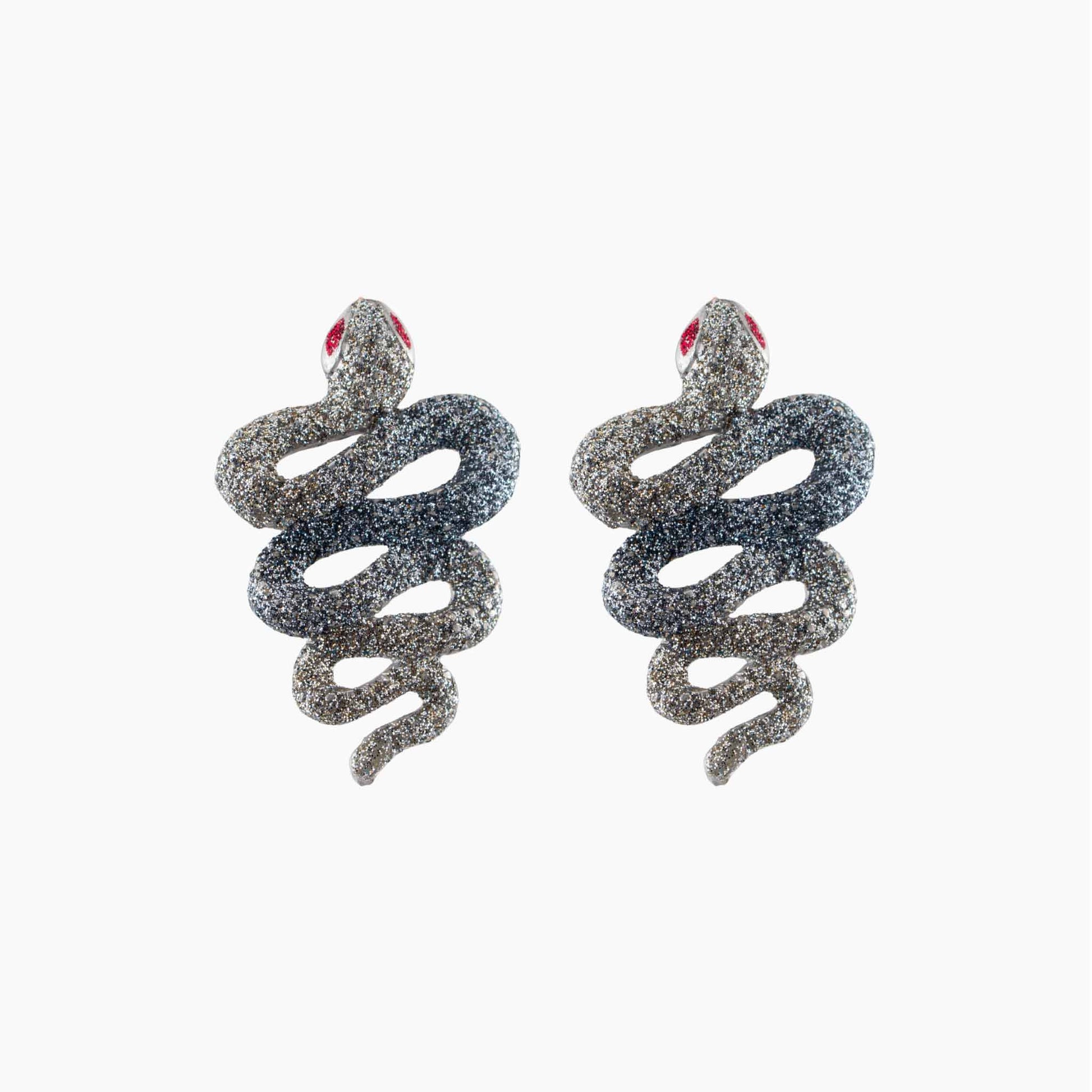 Snake-shaped earrings with glittery texture on a white background