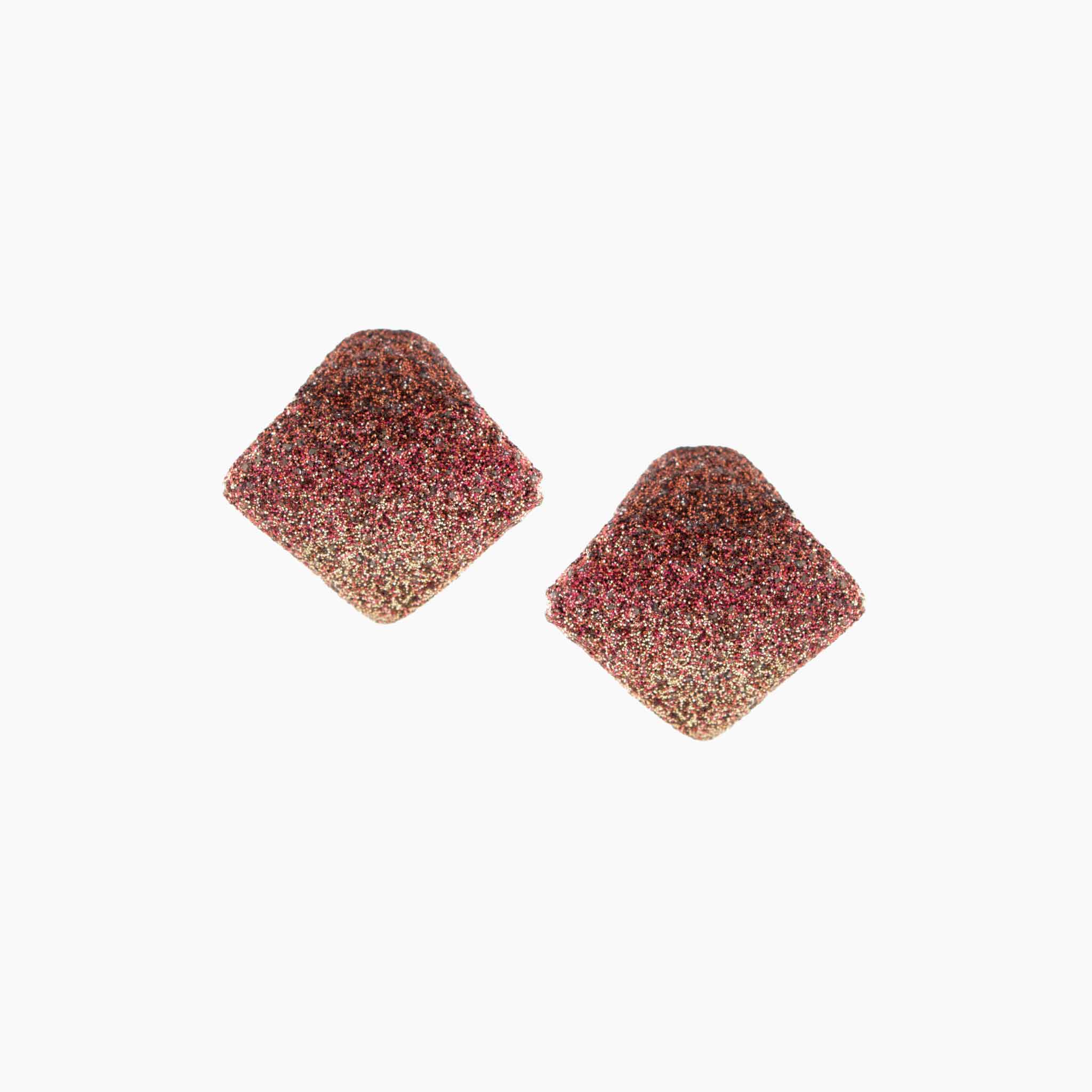 Pair of square-shaped earrings with a multicolored glittery finish on a white background