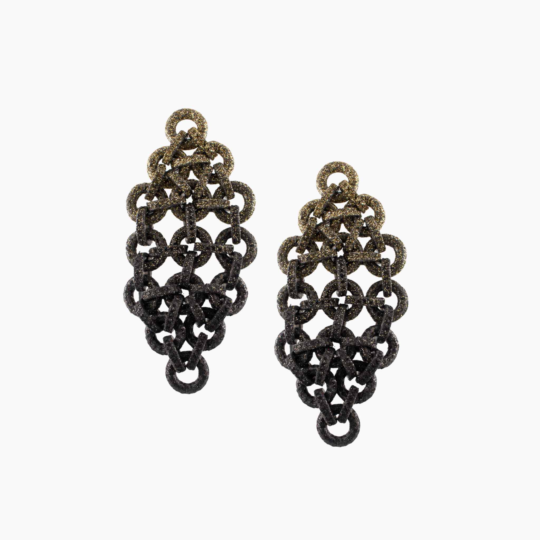 Pair of black chainmaille earrings on a white background
