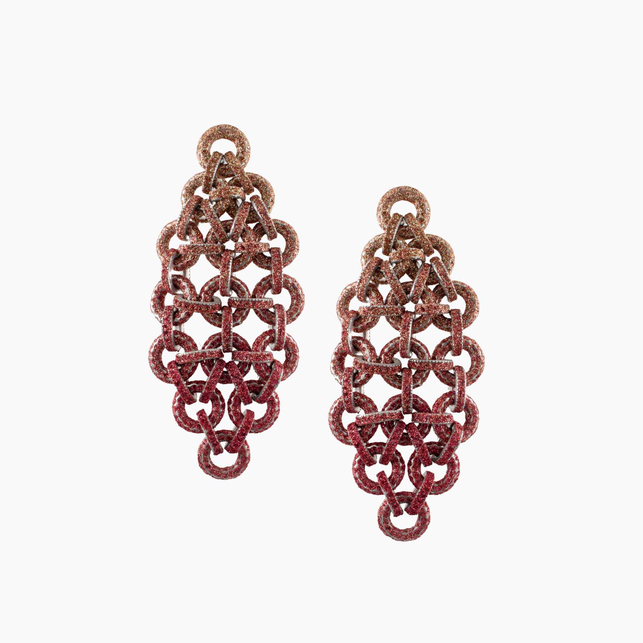 Pair of red chainmaille earrings on a white background