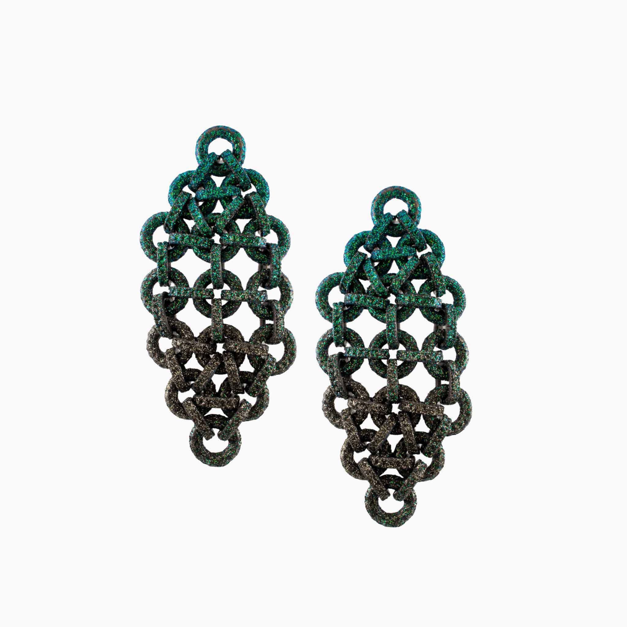 Pair of green and black earrings on a white background