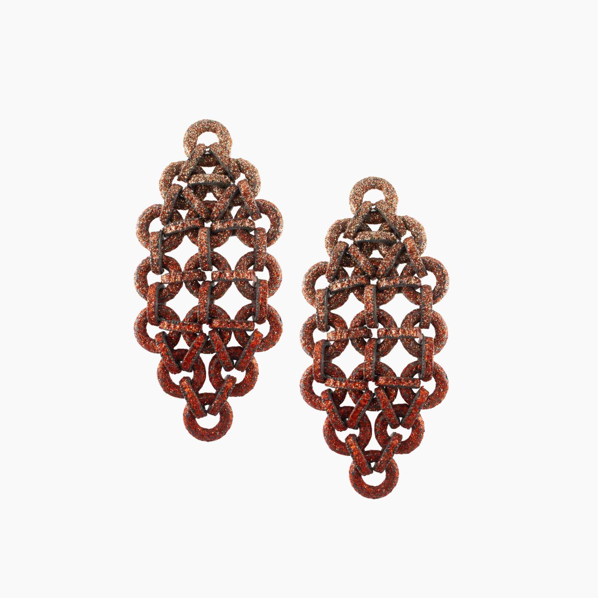 Pair of rust-colored chainmaille earrings on a white background