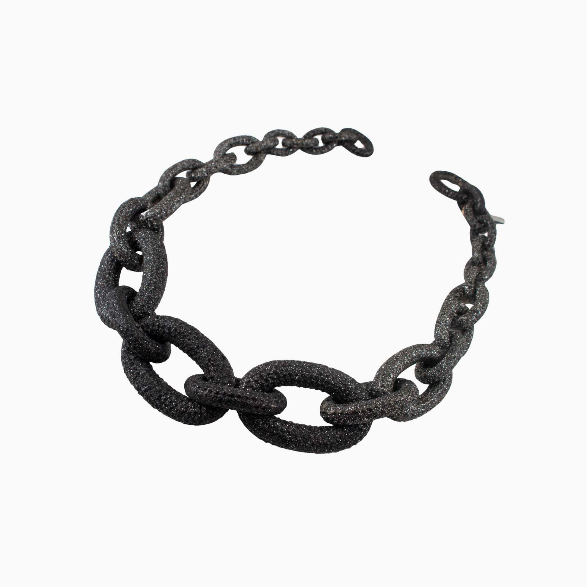Black chain bracelet on a white background