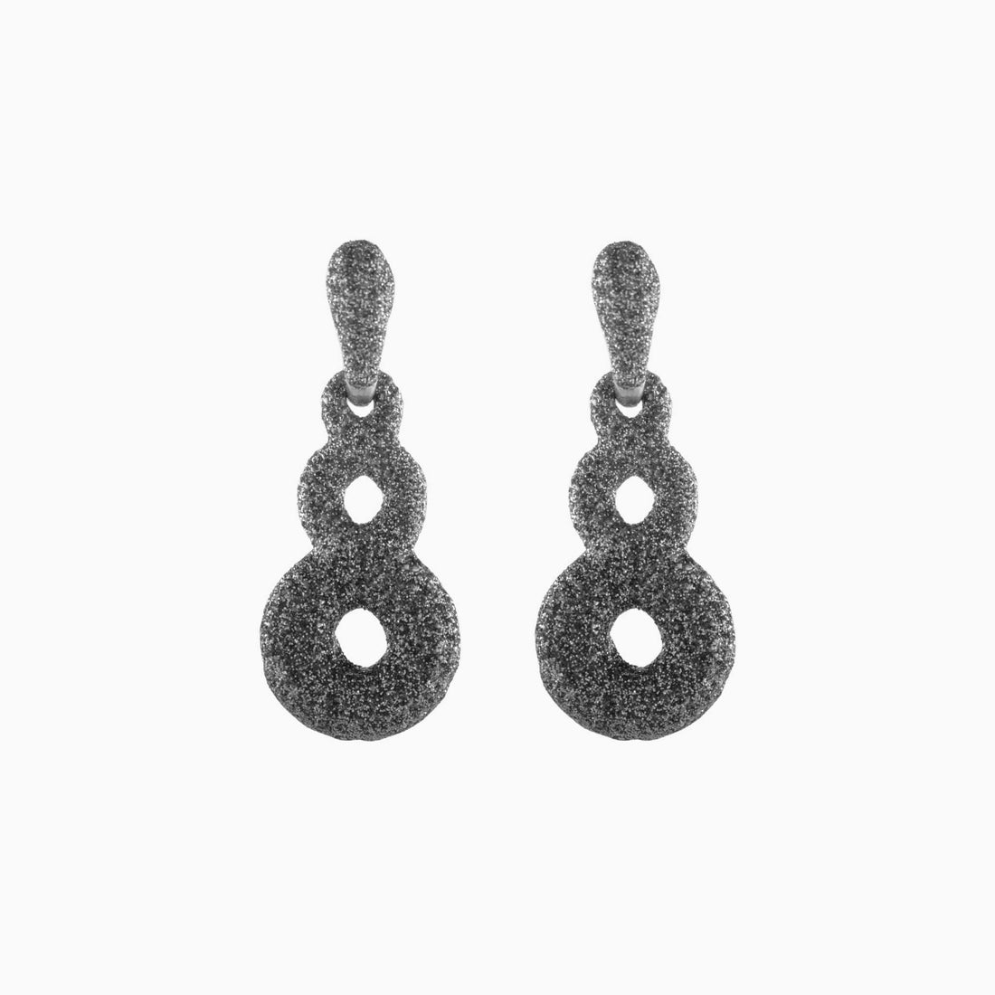 Pair of green textured earrings on a white background