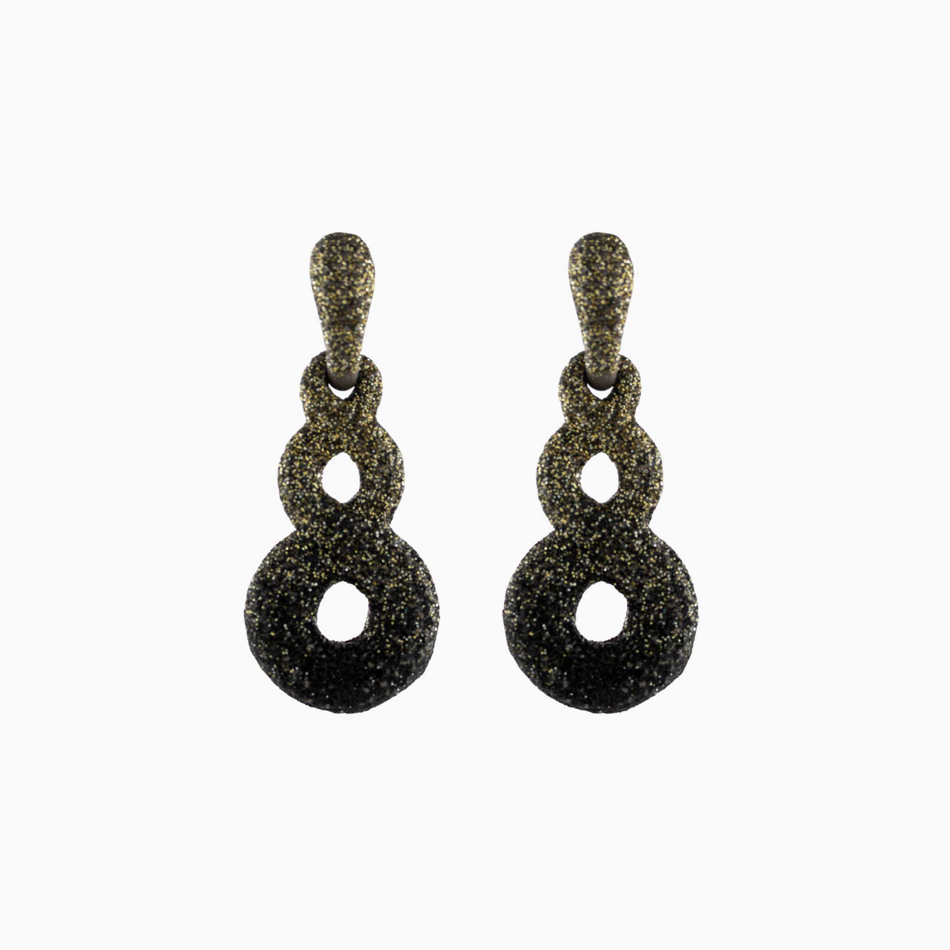 Pair of black and gold earrings on a white background