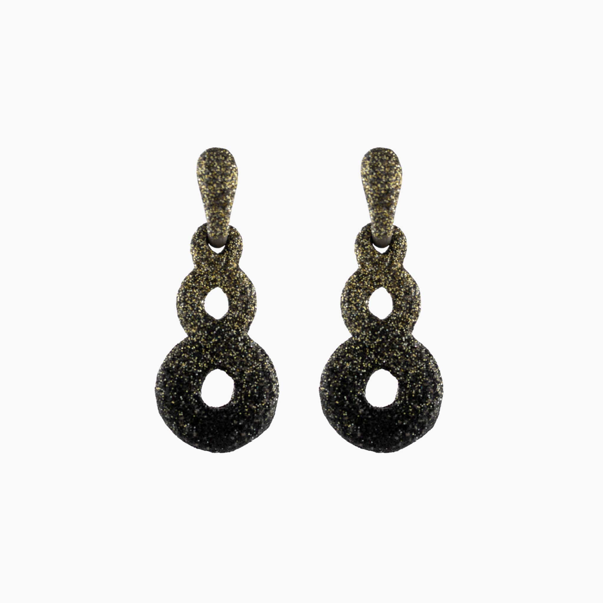 Pair of black and gold earrings on a white background