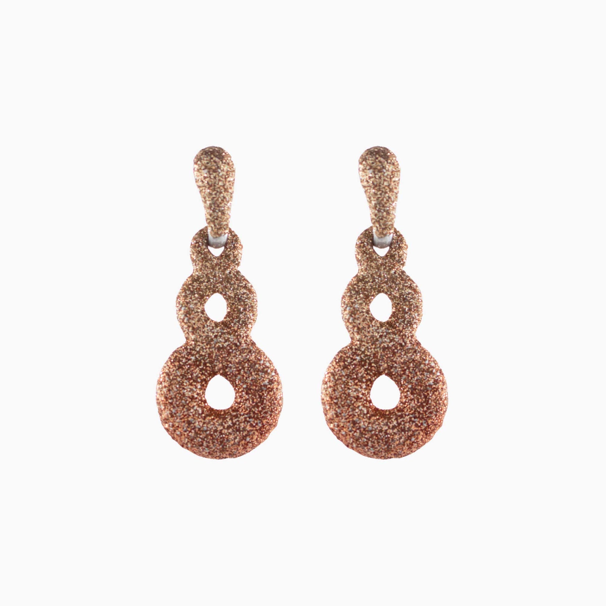 Pair of rose gold earrings on a white background