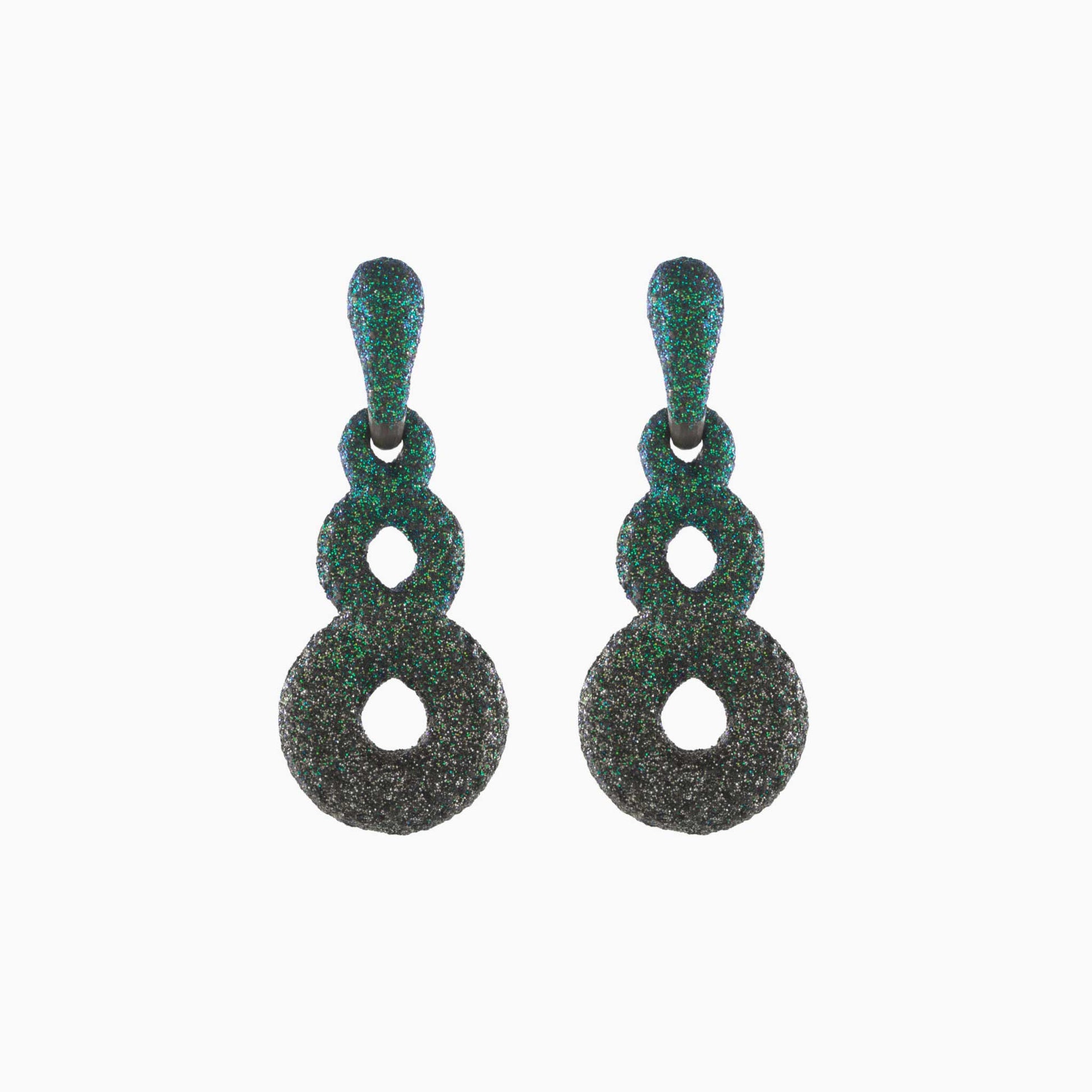 Pair of green textured earrings on a white background