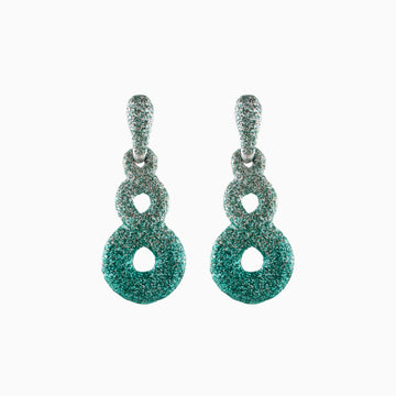 Pair of green textured earrings on a white background