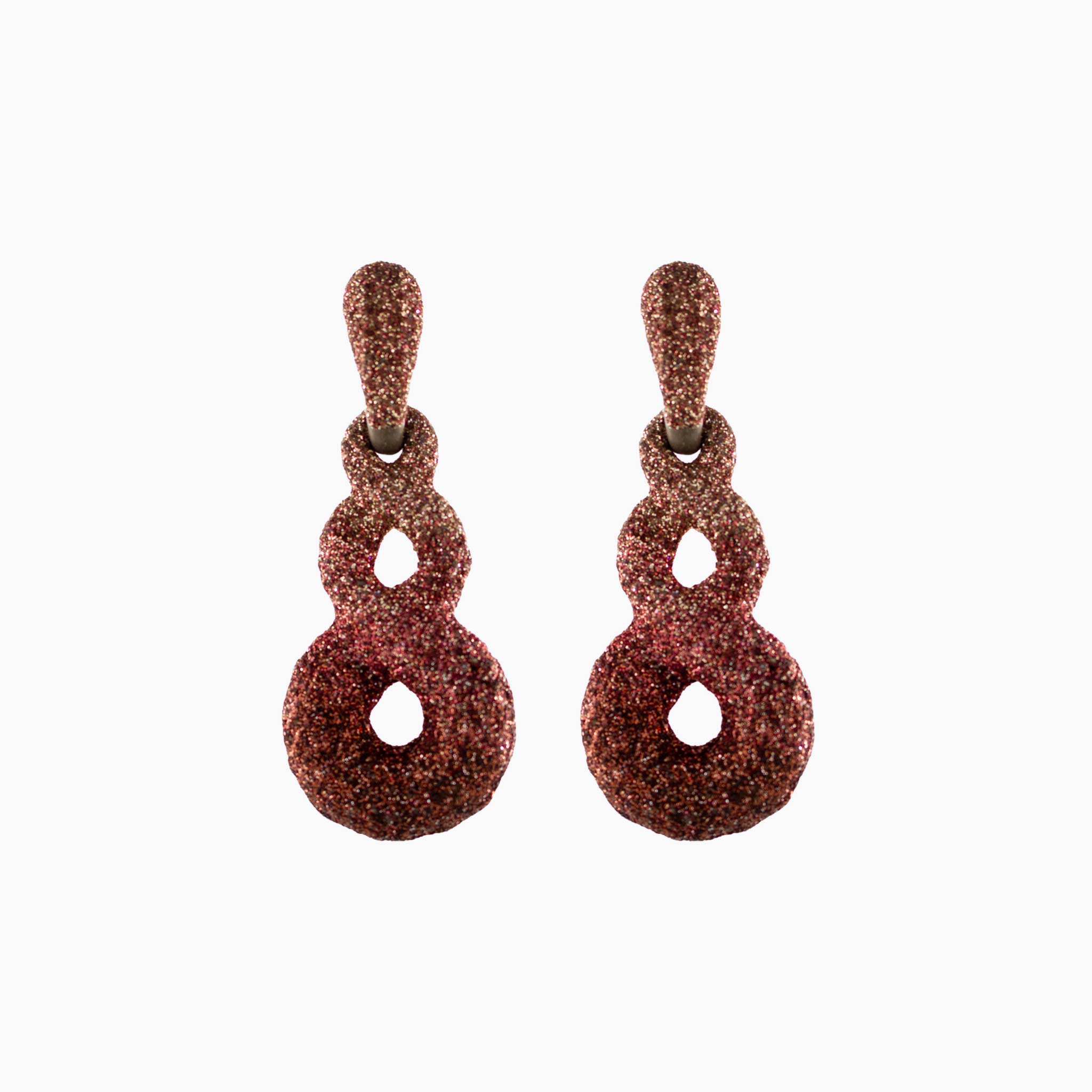 Pair of textured earrings on a white background