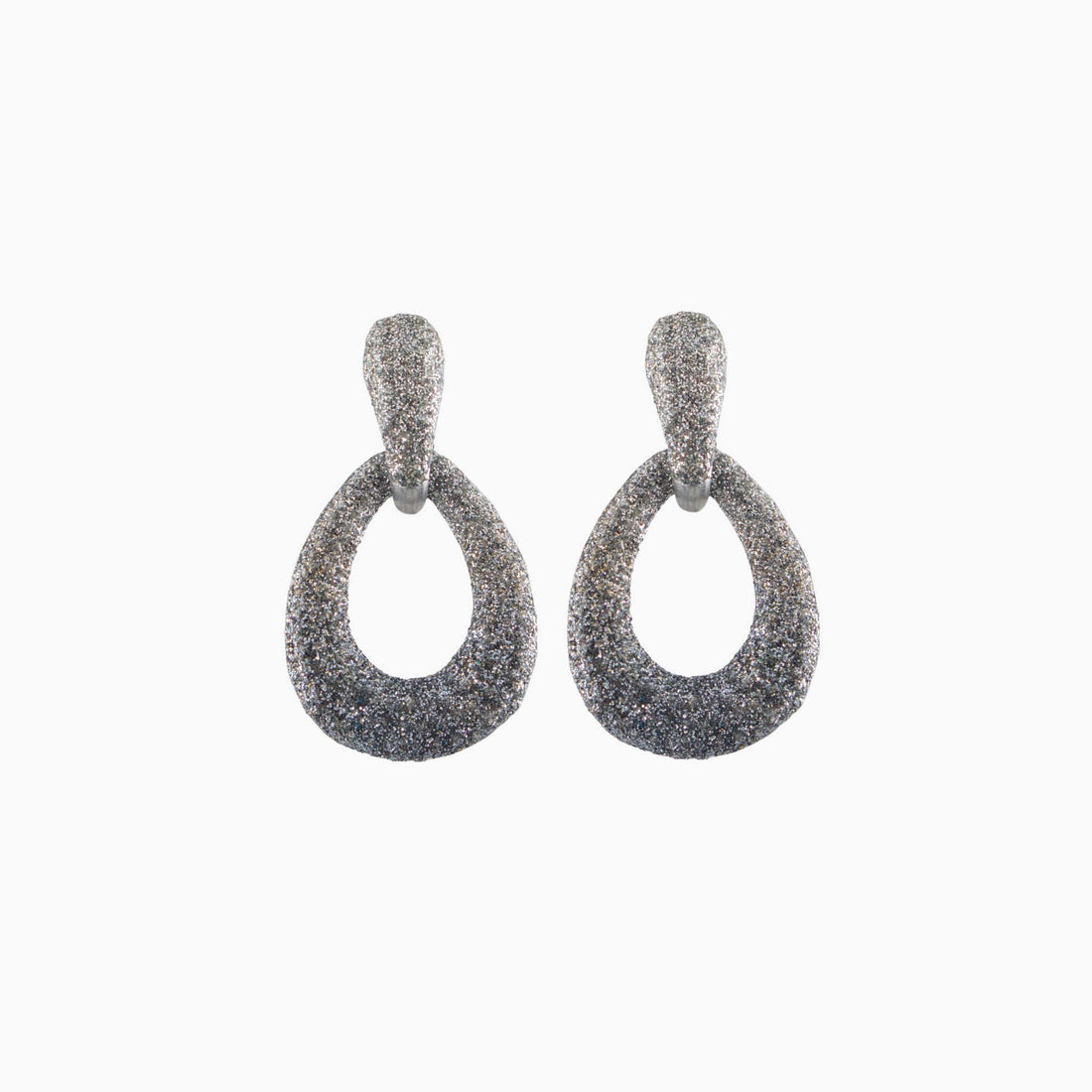 Pair of rose gold glittery hoop earrings on a white background