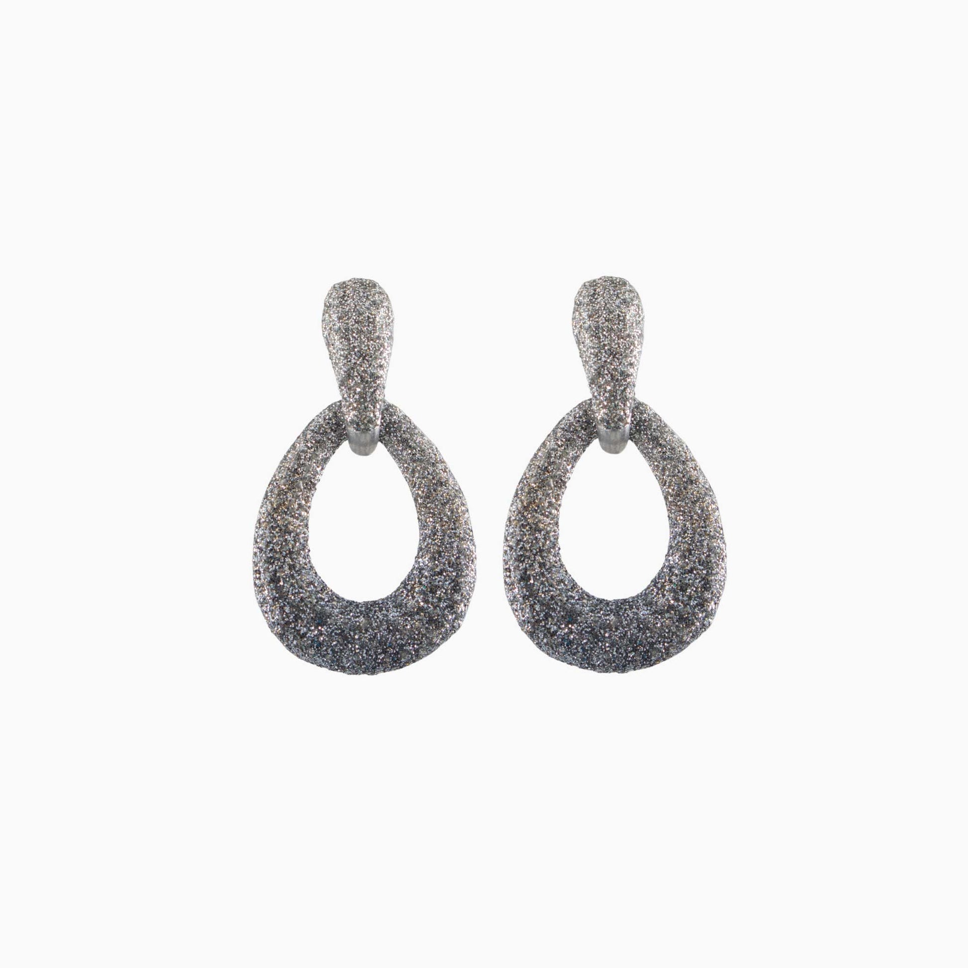 Pair of silver earrings on a white background