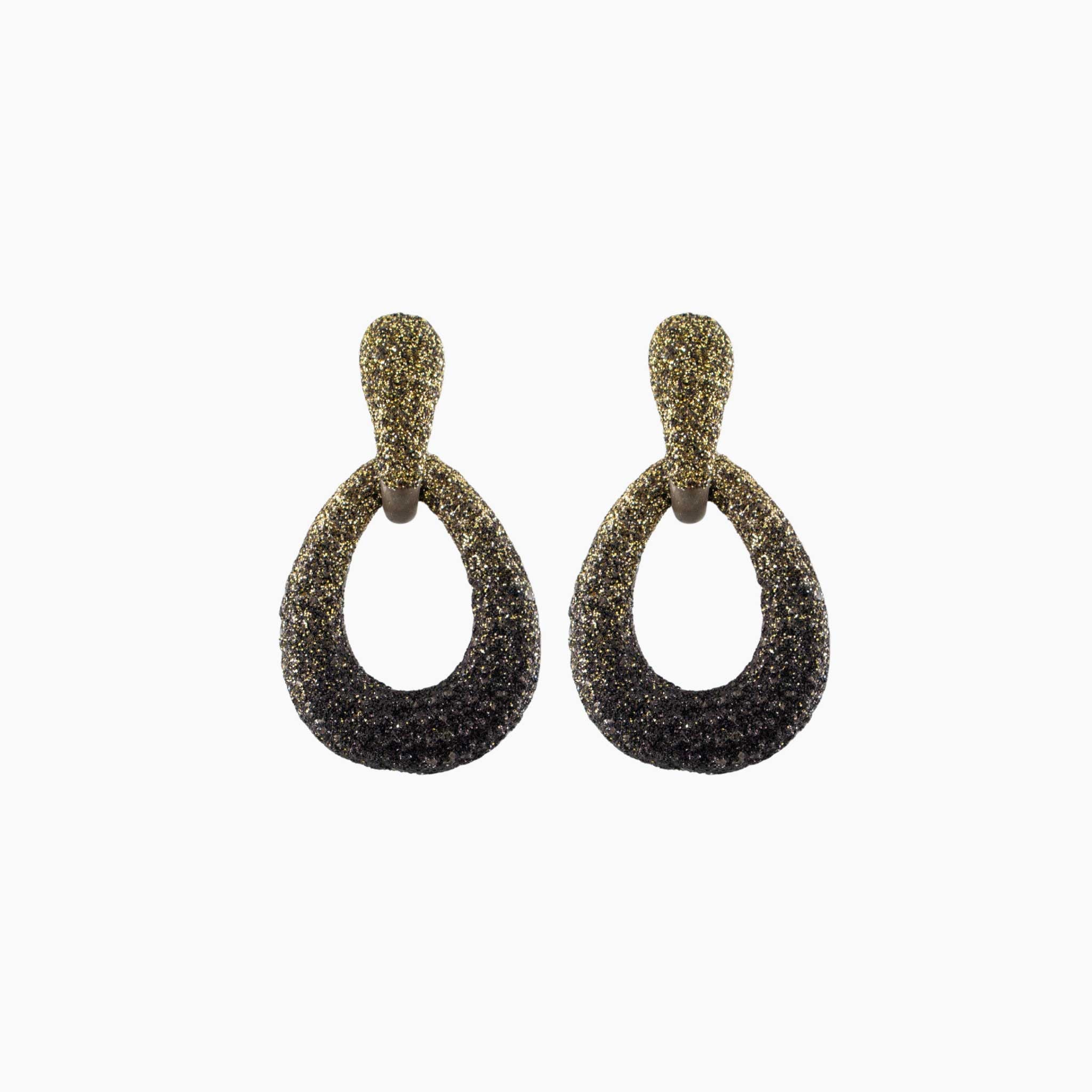 Pair of gold and black earrings on a white background
