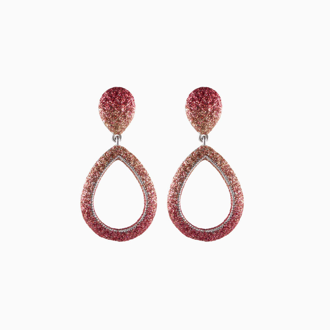 Pair of rose gold teardrop earrings on a white background
