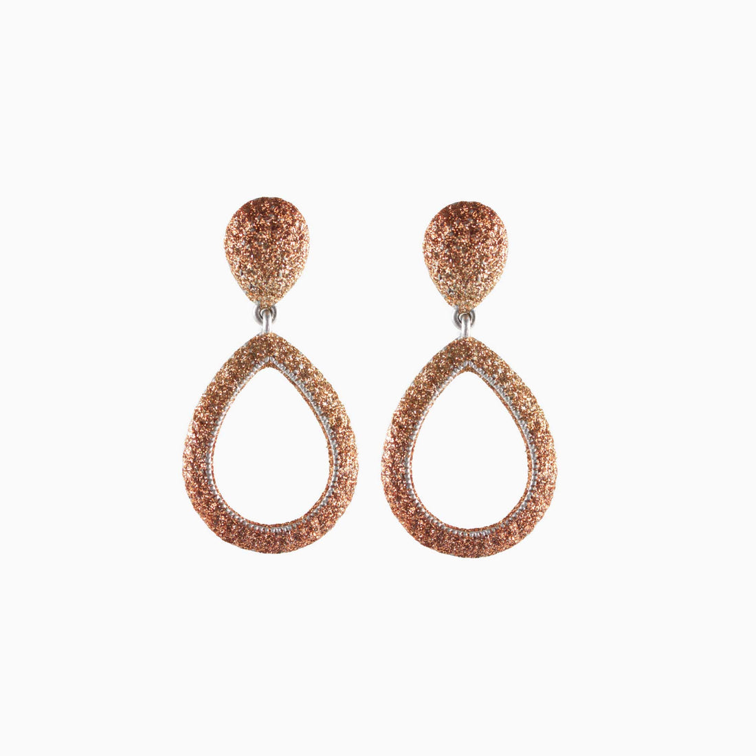 Pair of rose gold teardrop earrings on a white background