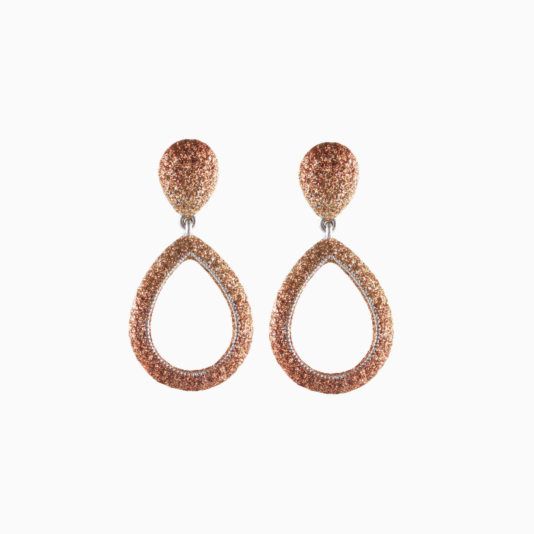 Pair of rose gold teardrop earrings on a white background