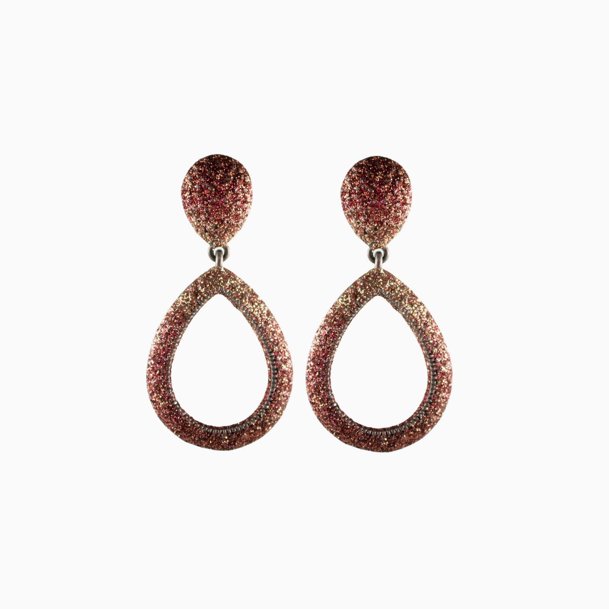 Pair of teardrop-shaped earrings with glittery finish on a white background