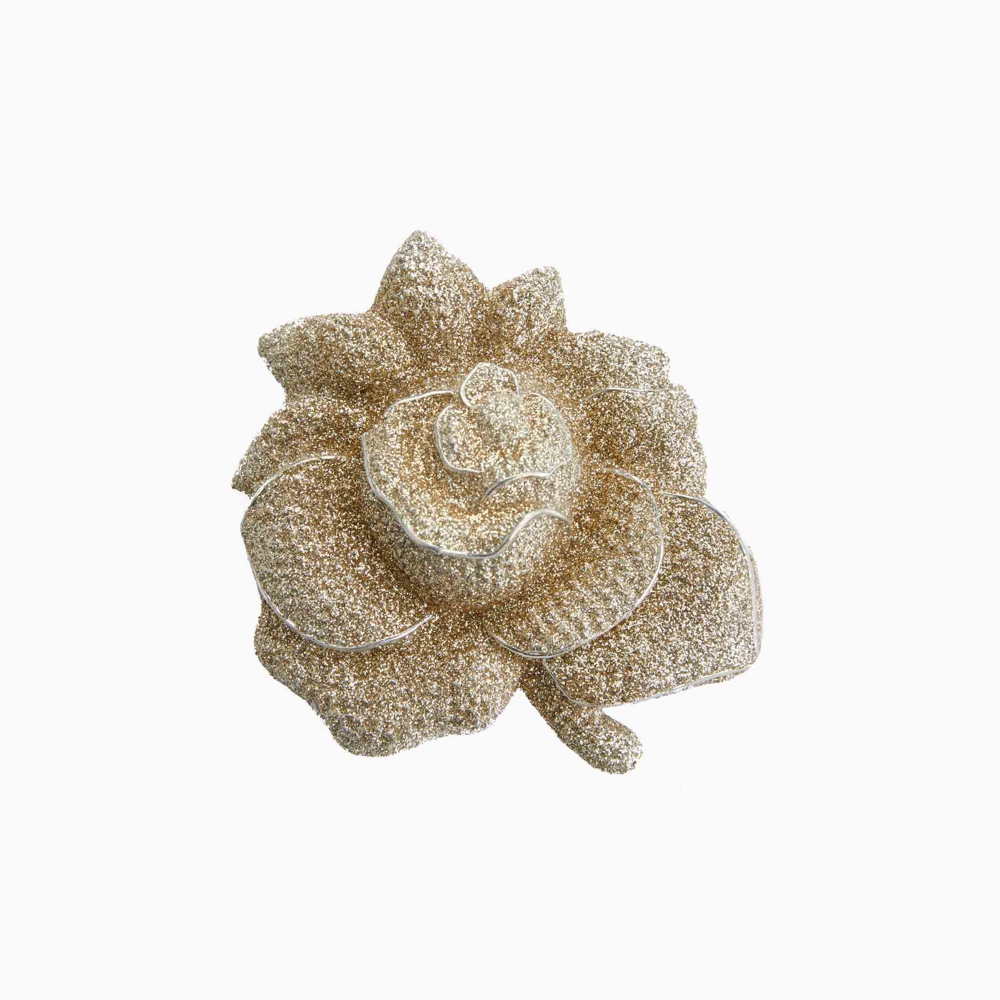 Decorative brooch with a floral design on a white background
