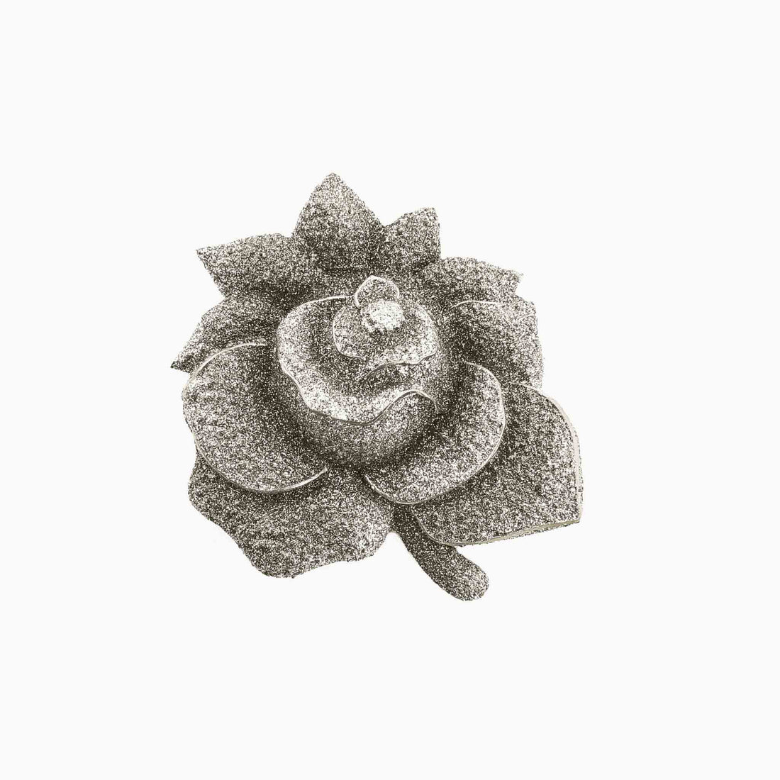 Decorative brooch with a floral design on a white background