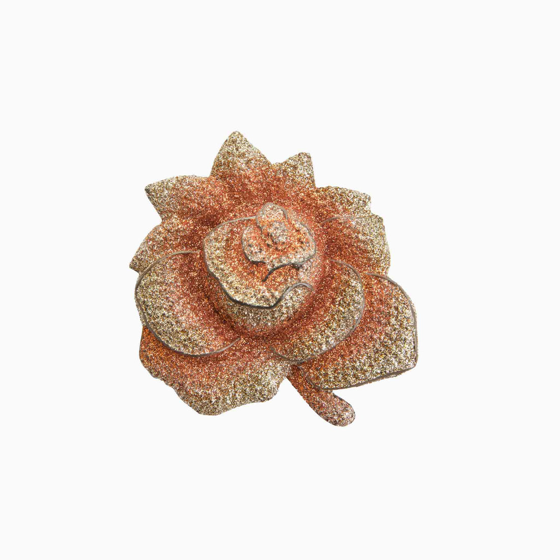 Decorative brooch with a floral design on a white background