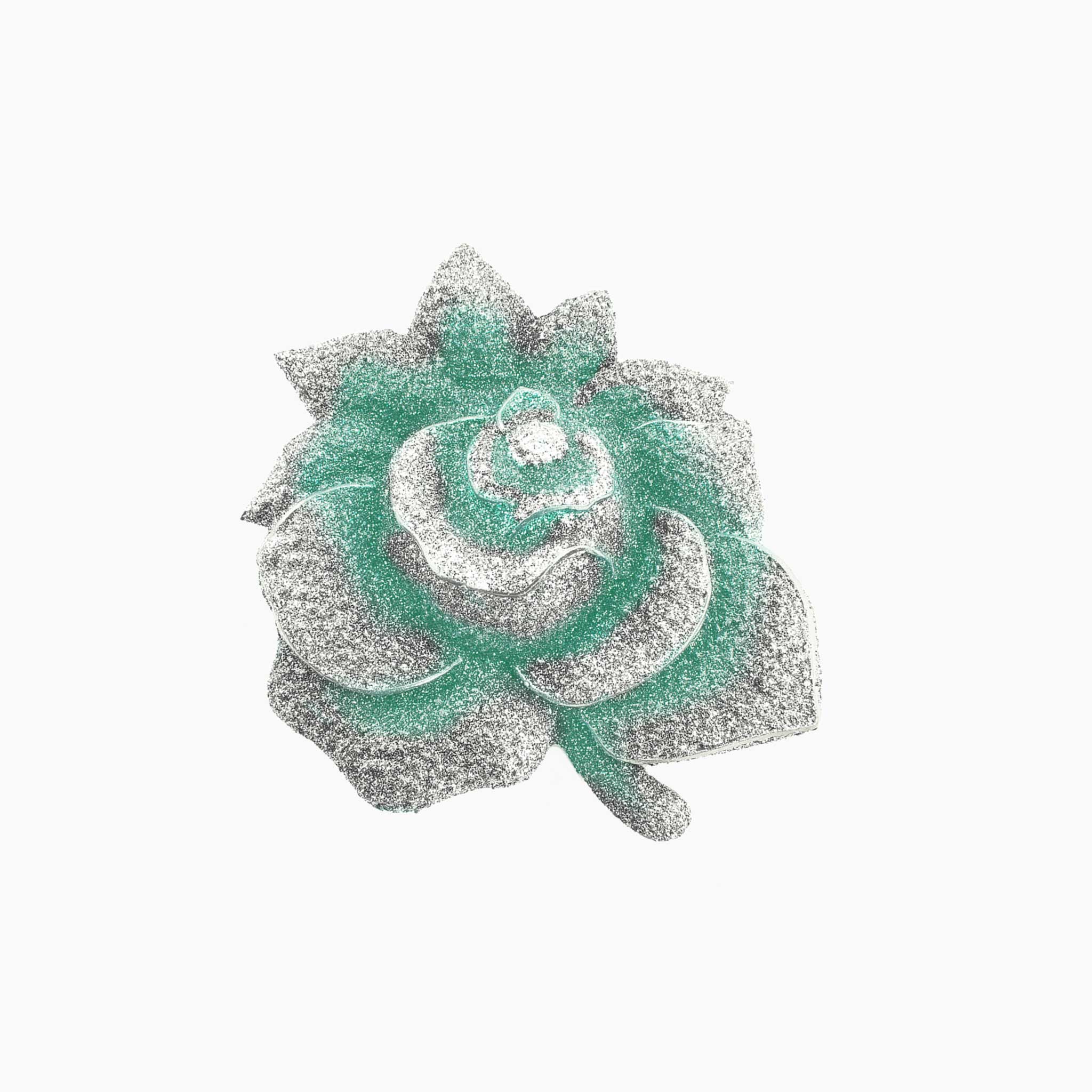 Decorative brooch with a floral design on a white background