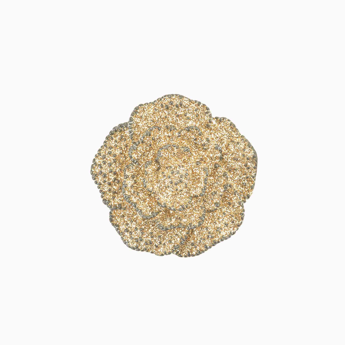 Decorative brooch with a floral design on a white background