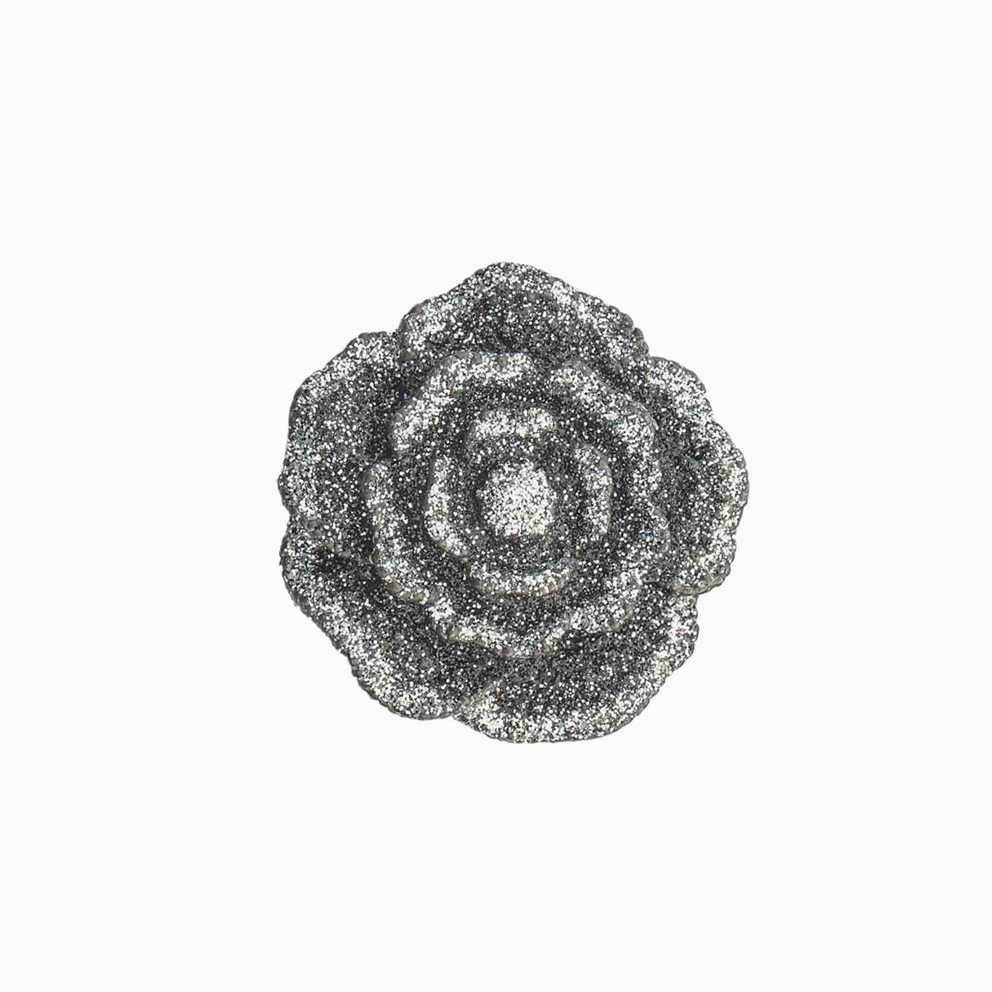 Decorative brooch with a floral design on a white background