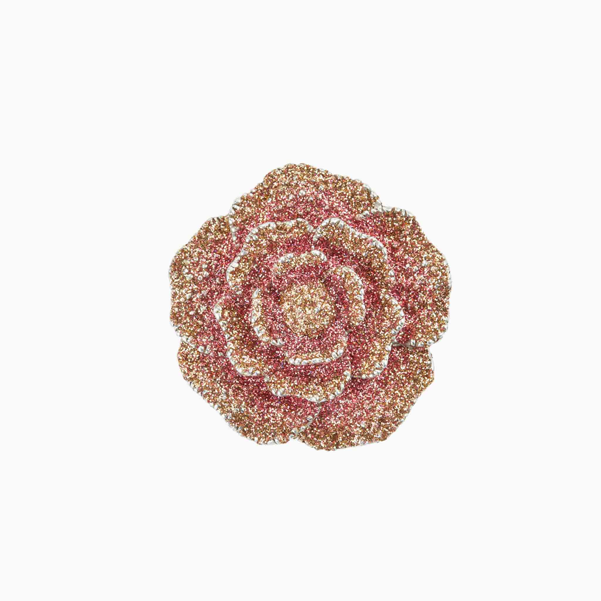 Decorative brooch with a floral design on a white background