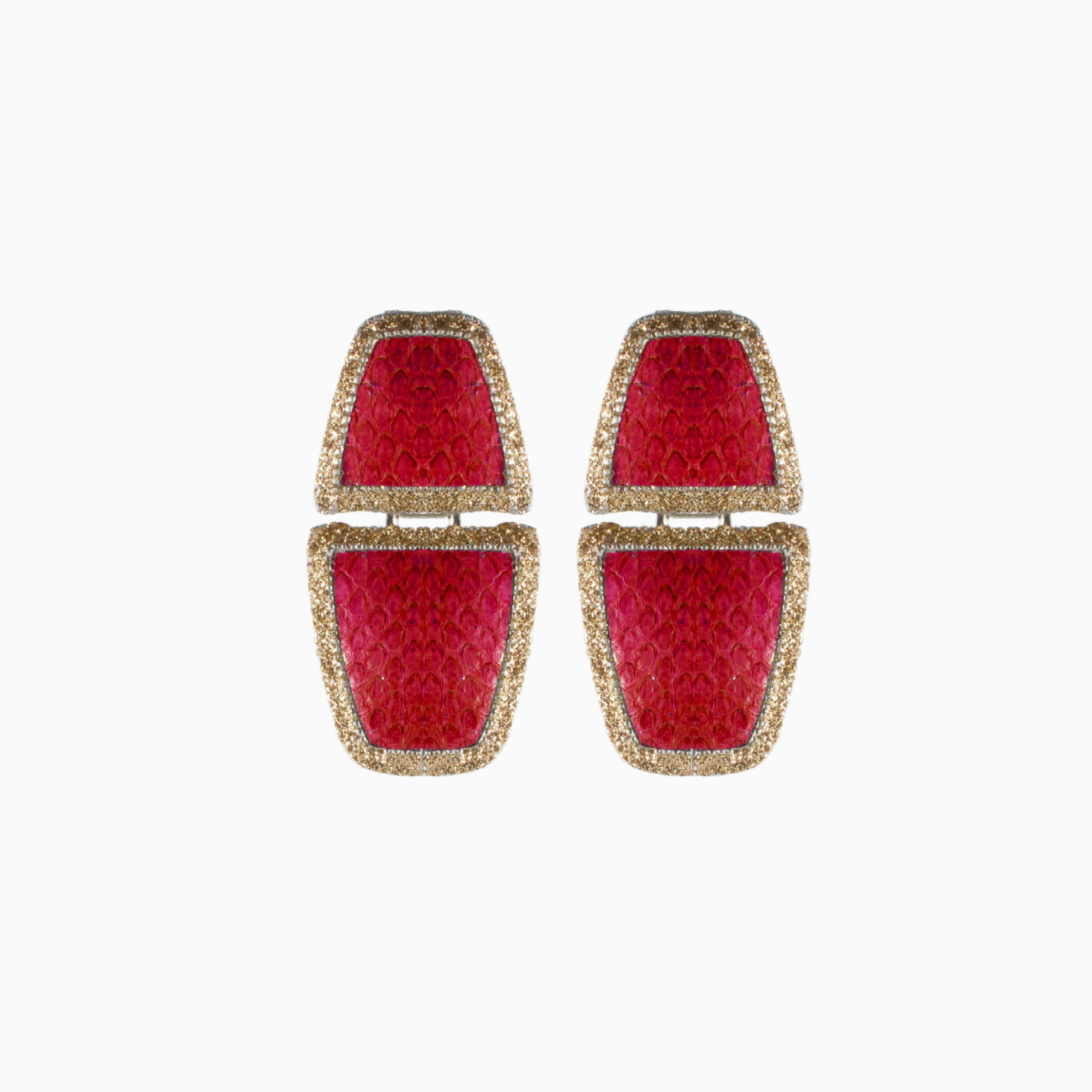 Pair of red earrings with gold accents on a white background