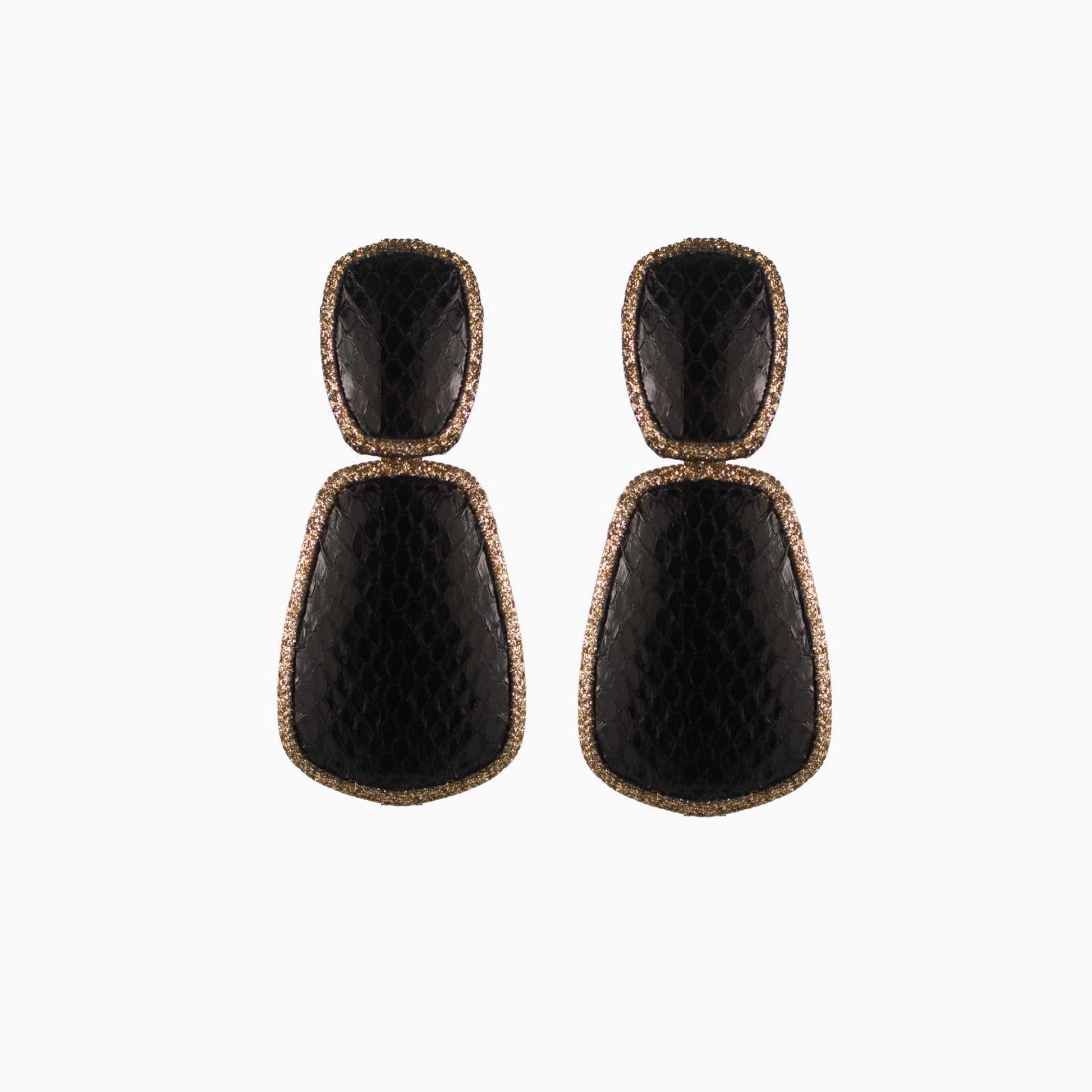 Pair of black earrings with gold accents on a white background