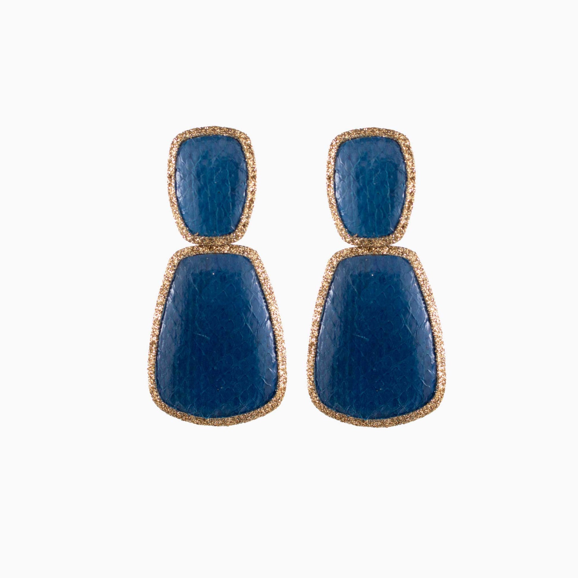 Pair of blue earrings with gold accents on a white background