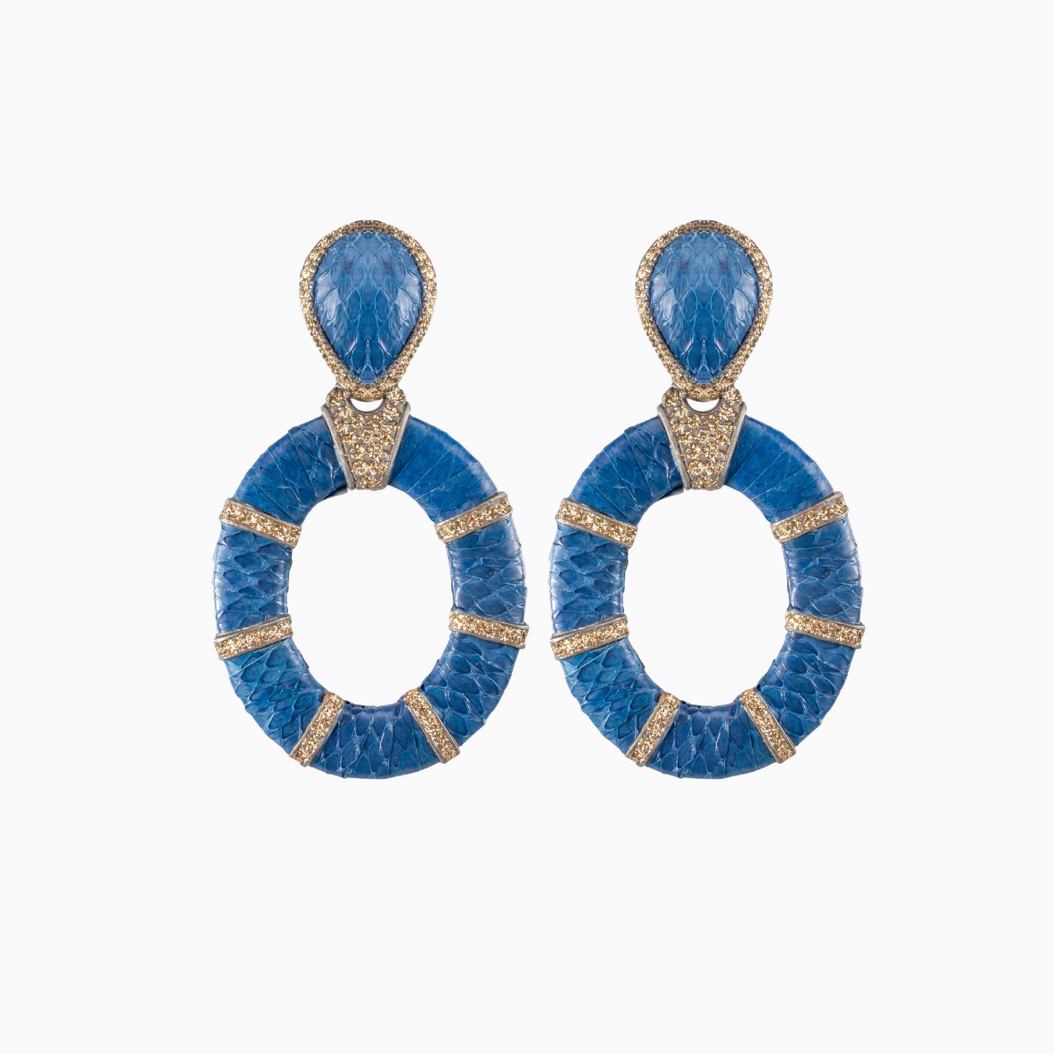 Pair of blue earrings with gold accents on a white background
