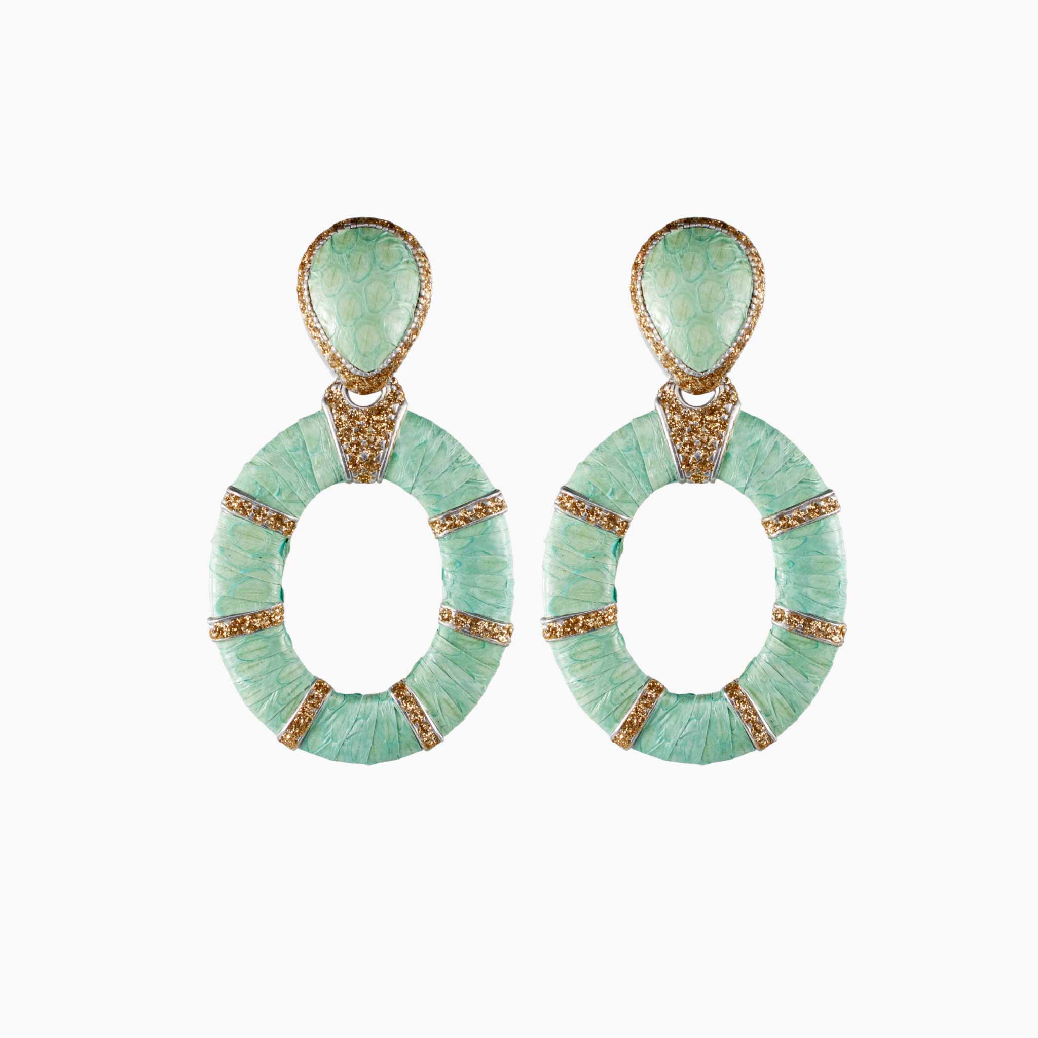 Pair of green earrings with gold accents on a white background