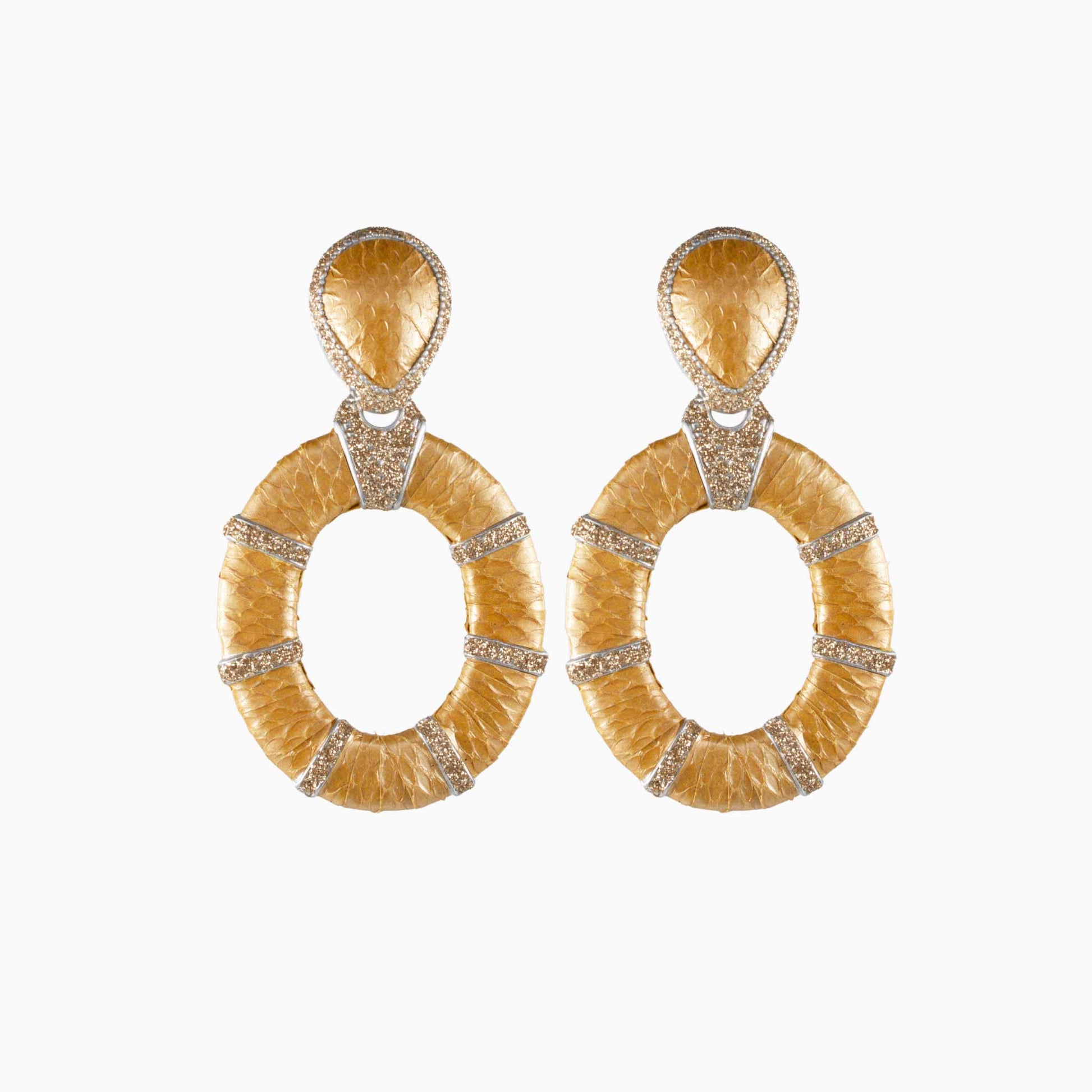 Pair of gold earrings with circular design on a white background