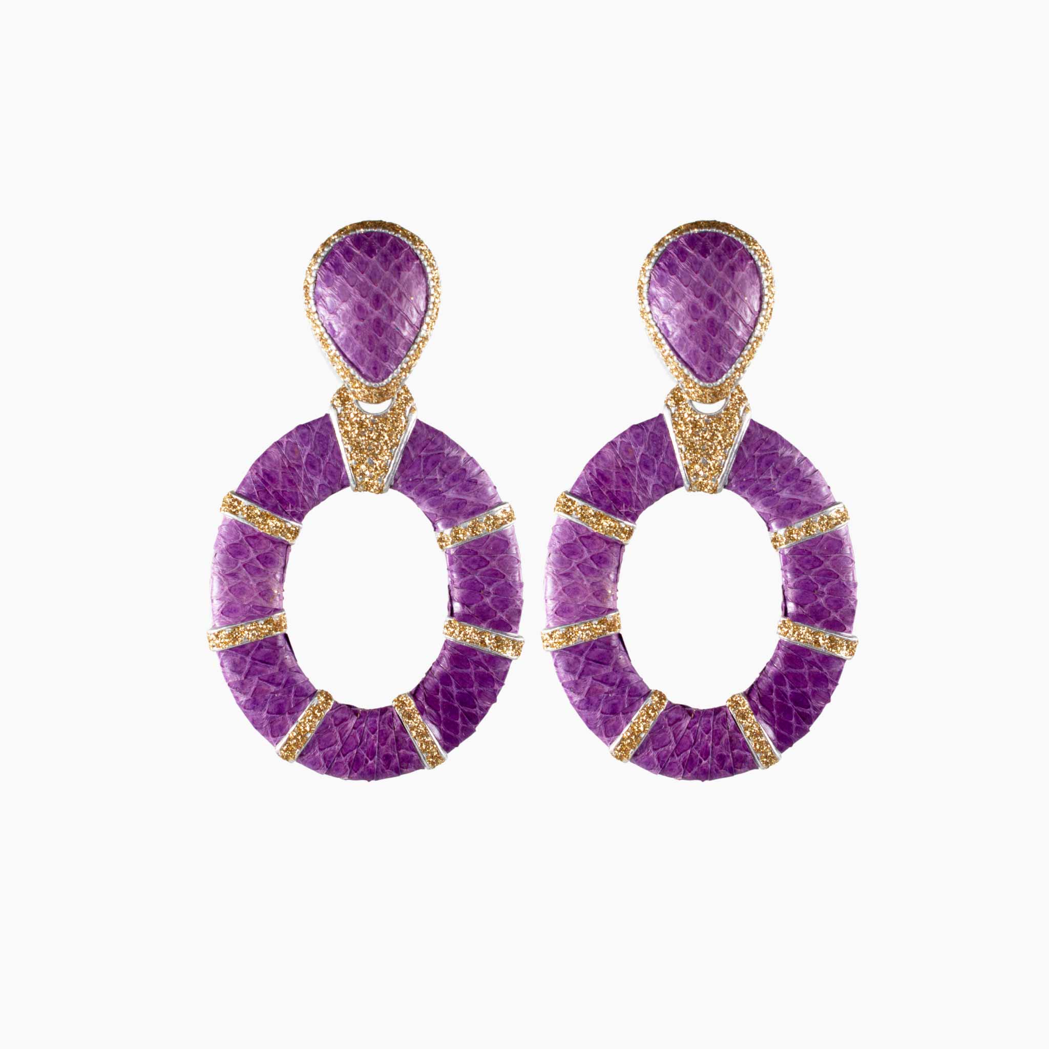 Purple earrings with gold accents on a white background